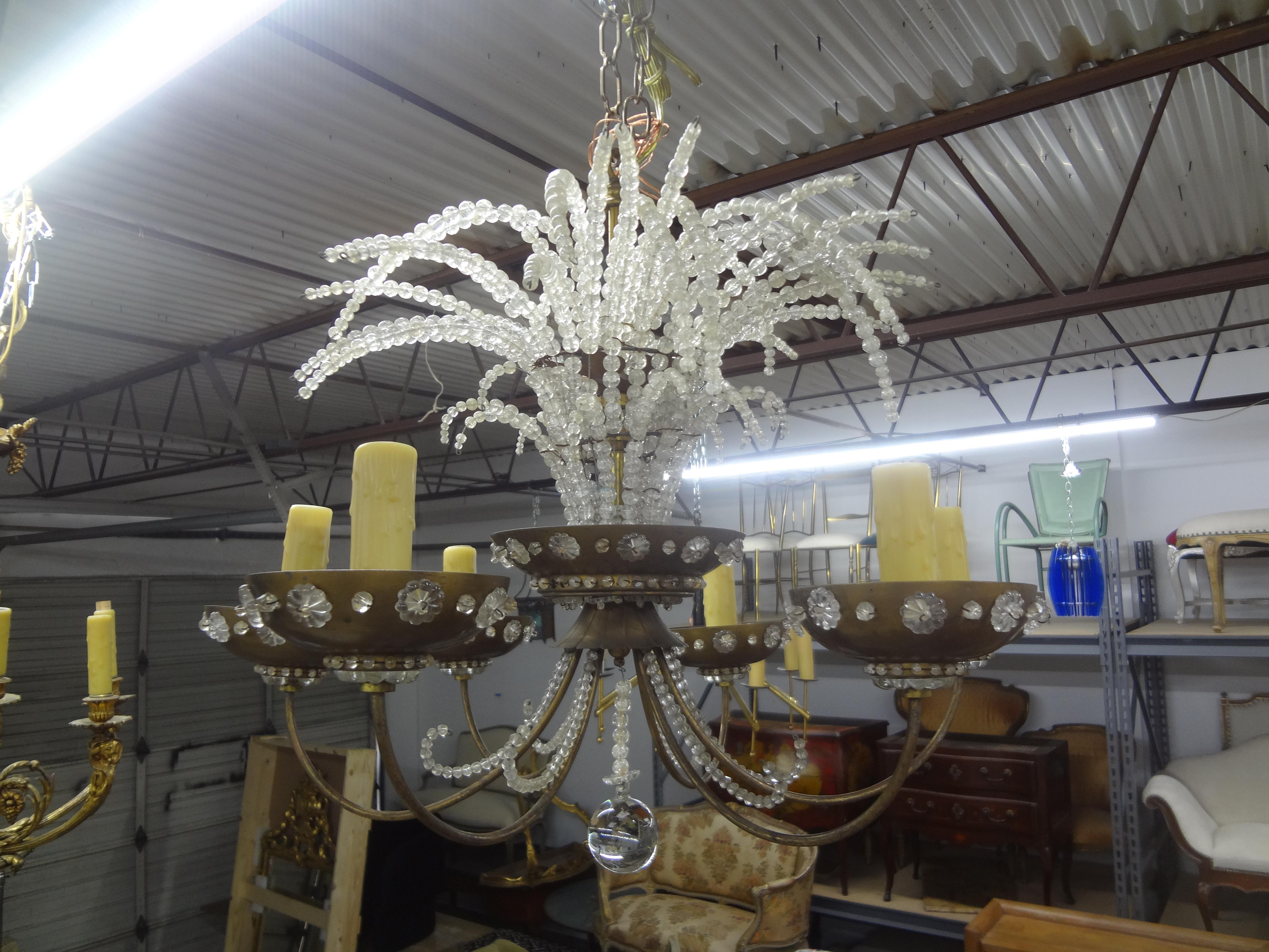 French Maison Bagues Beaded Crystal Chandelier.
This stunning French crystal chandelier has 6 arms, crystal embellished bobeches with candelabra sockets and sprays of crystal beads at the top.
Newly wired for the U.S. market with new sockets and