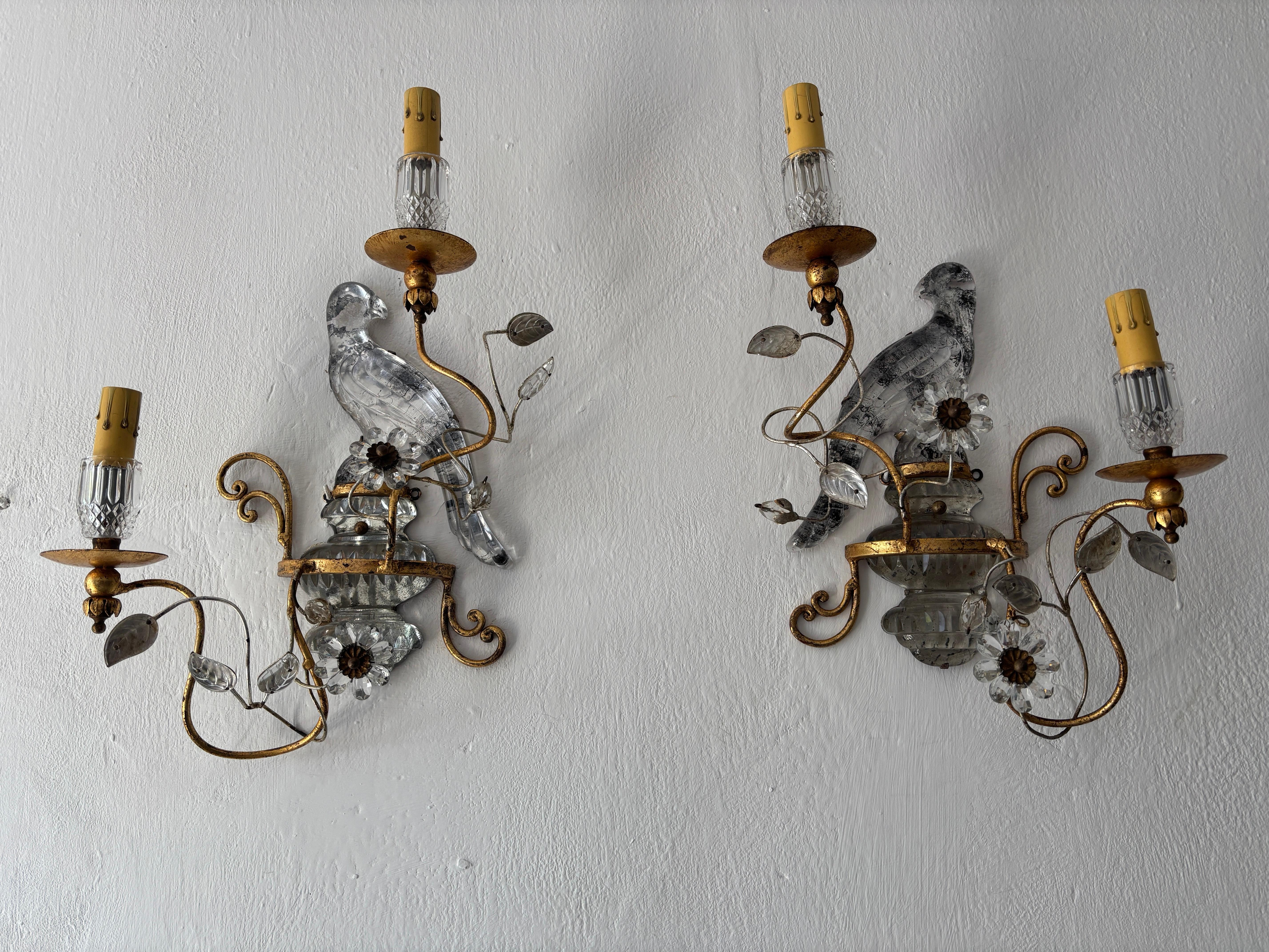 Highly sought after pair signed Maison Bagues double arm sconces. These will be newly rewired with certified US UL sockets for the USA and appropriate sockets for all other countries and ready to hang. Two crystal bulb holders, flowers and parrots