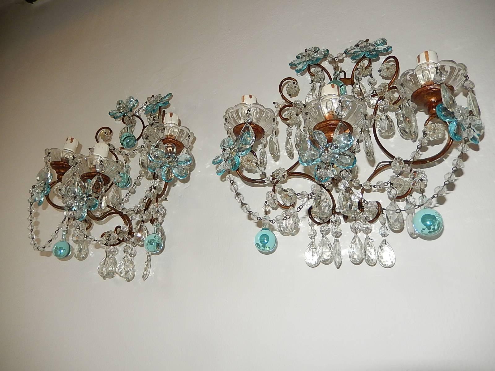 Housing three lights. Will be re-wired with certified UL US sockets for the United States and appropriate sockets for other countries and ready to hang. Crystal bobeches dripping with crystal prisms. Aqua crystal prisms flowers and swags of macaroni