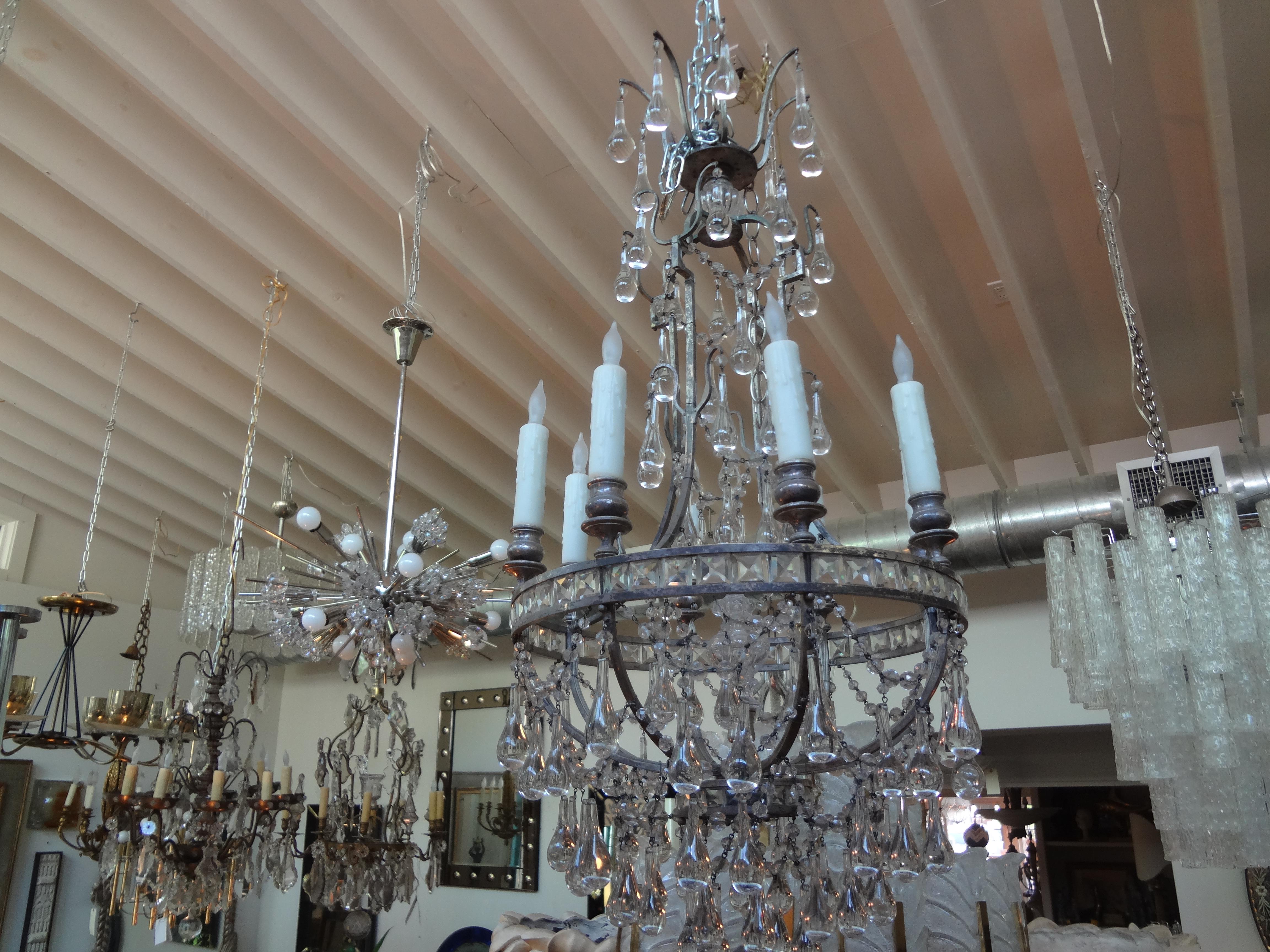 Chic French Maison Baguès inspired silvered bronze and crystal 8-light chandelier. This stunning crystal chandelier is newly wired for U.S. market and can be suspended from a chain for the desired height needed.
This versatile French crystal