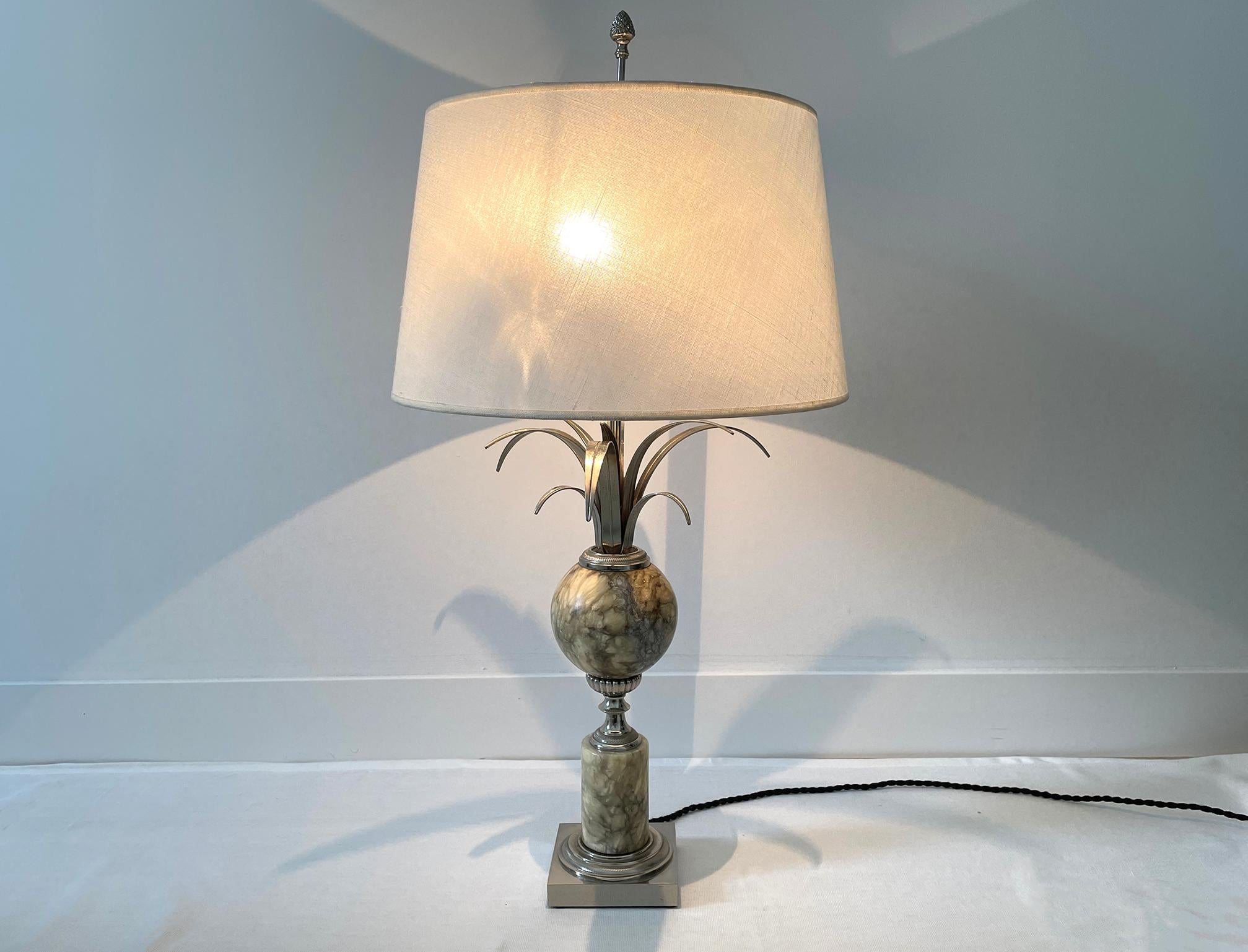 A table lamp from the 70s, in the style of the Maison Charles, in chrome and nickel-plated metal and the central ball in marbled stone, the wiring is new in black silk cord and the lampshade in off-white linen, it has two light bulbs.