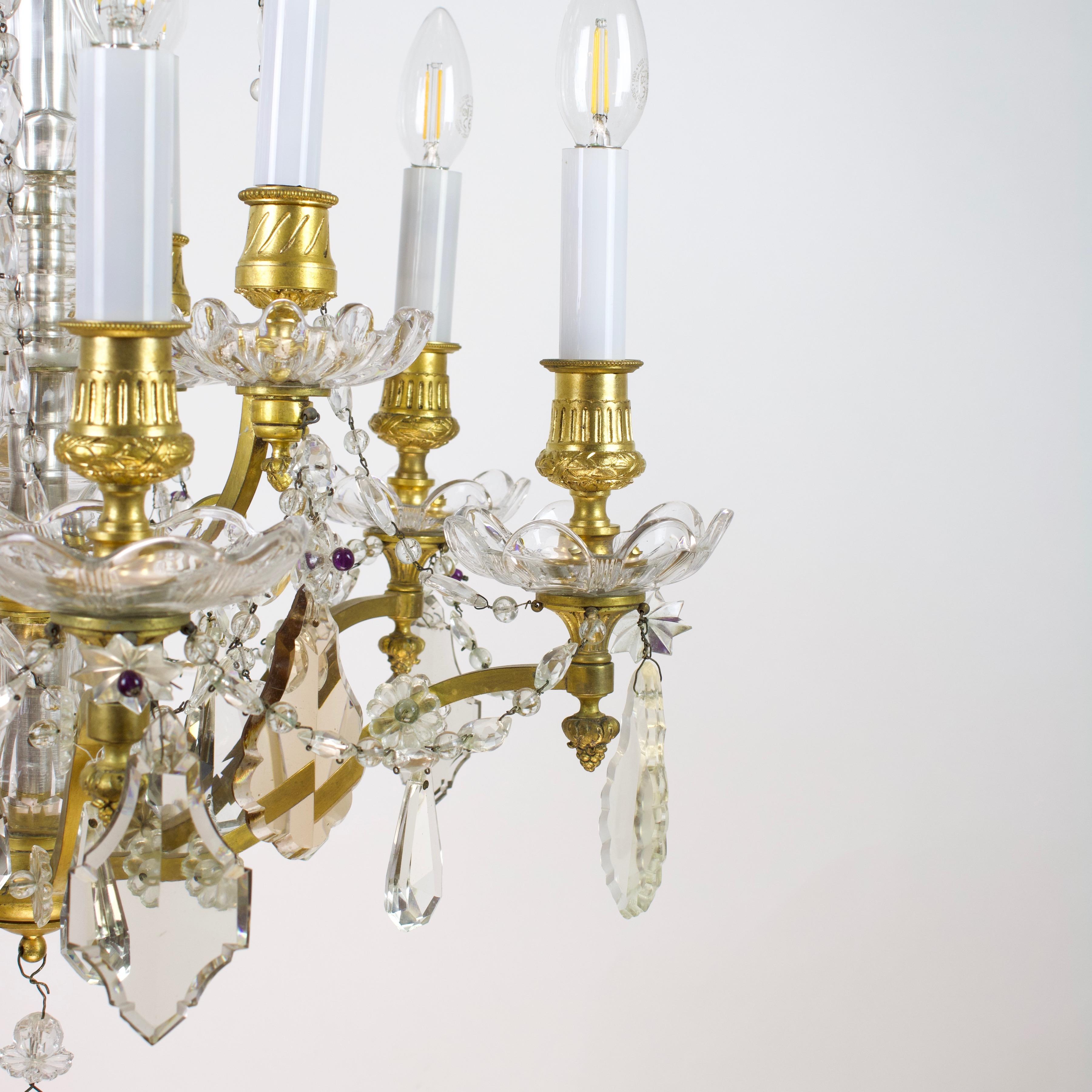 French Maison Colin 19th Century Louis XV gilt bronze cut crystal chandelier

A 9-light French Louis XV chandelier, made in France ca. 1880 by Maison COLIN featuring gilt bronze s-shaped arms on two levels issuing from a central stem covered with