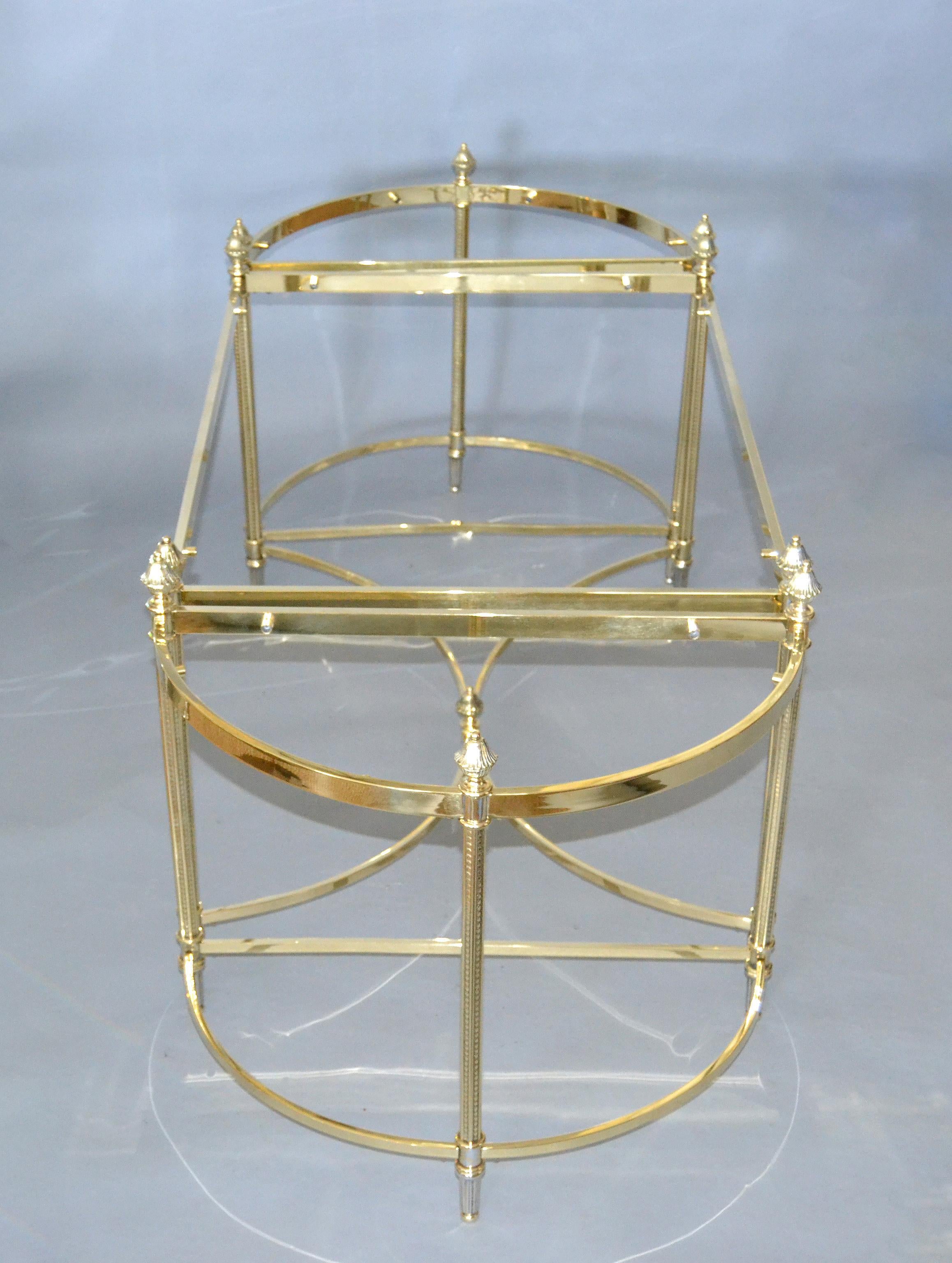 French Maison Jansen / Baguès brass and glass three pieces coffee table, 1950s.
The 3 glass pieces will be customized.
 
Measurements 2 small pieces:
Depth 11.5 inches
Length 22 inches
Height 19 inches.
Measurements rectangular table:
Depth