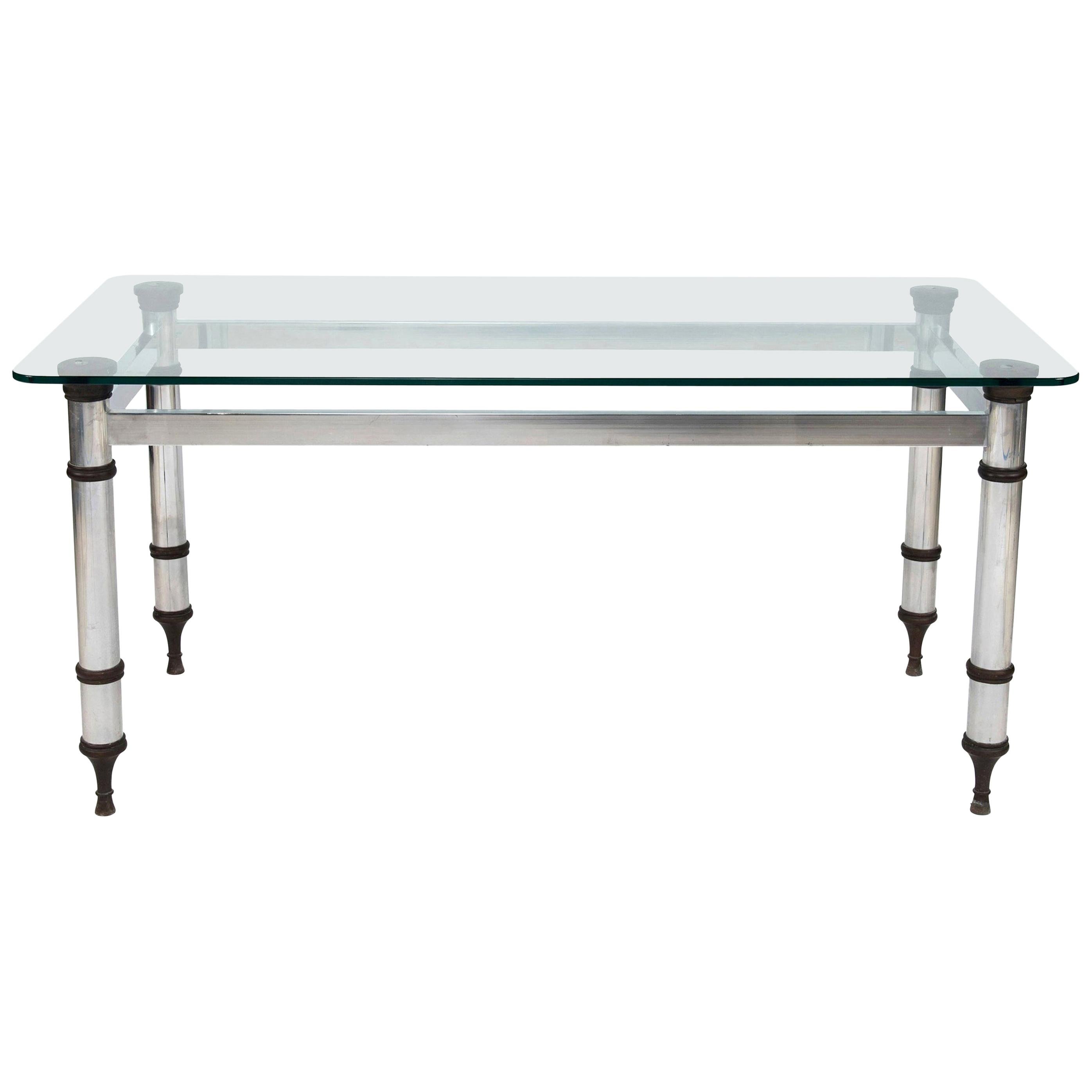 Table française de style Maison Jansen en acier et bronze avec plateau en verre