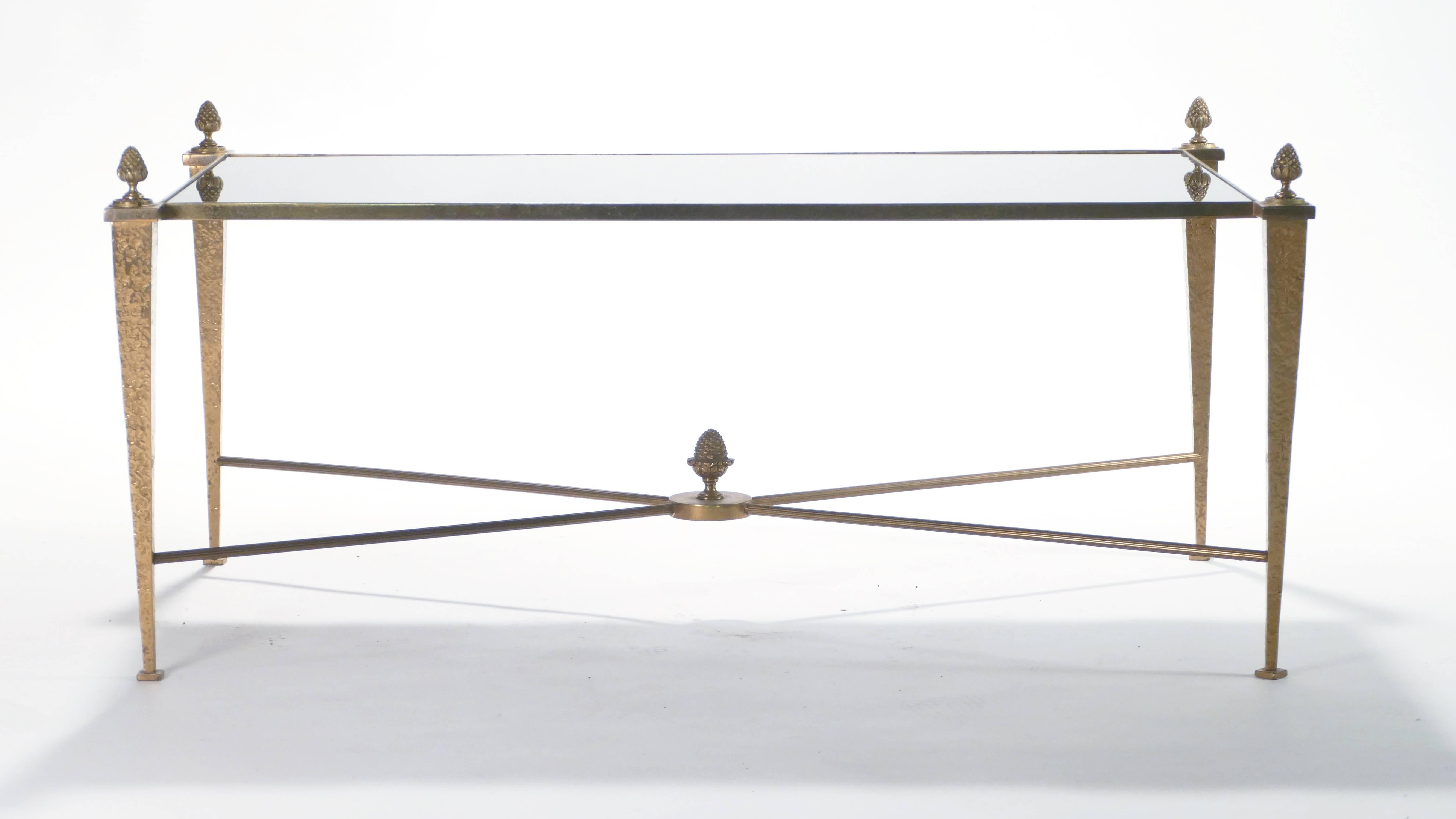 This coffee table by French design house Maison Ramsay was created with high-quality materials like sleek black opaline, gold gilt, and brass. The black opaline surface is impossibly smooth, while the gold gilt feet and brass pine cone details