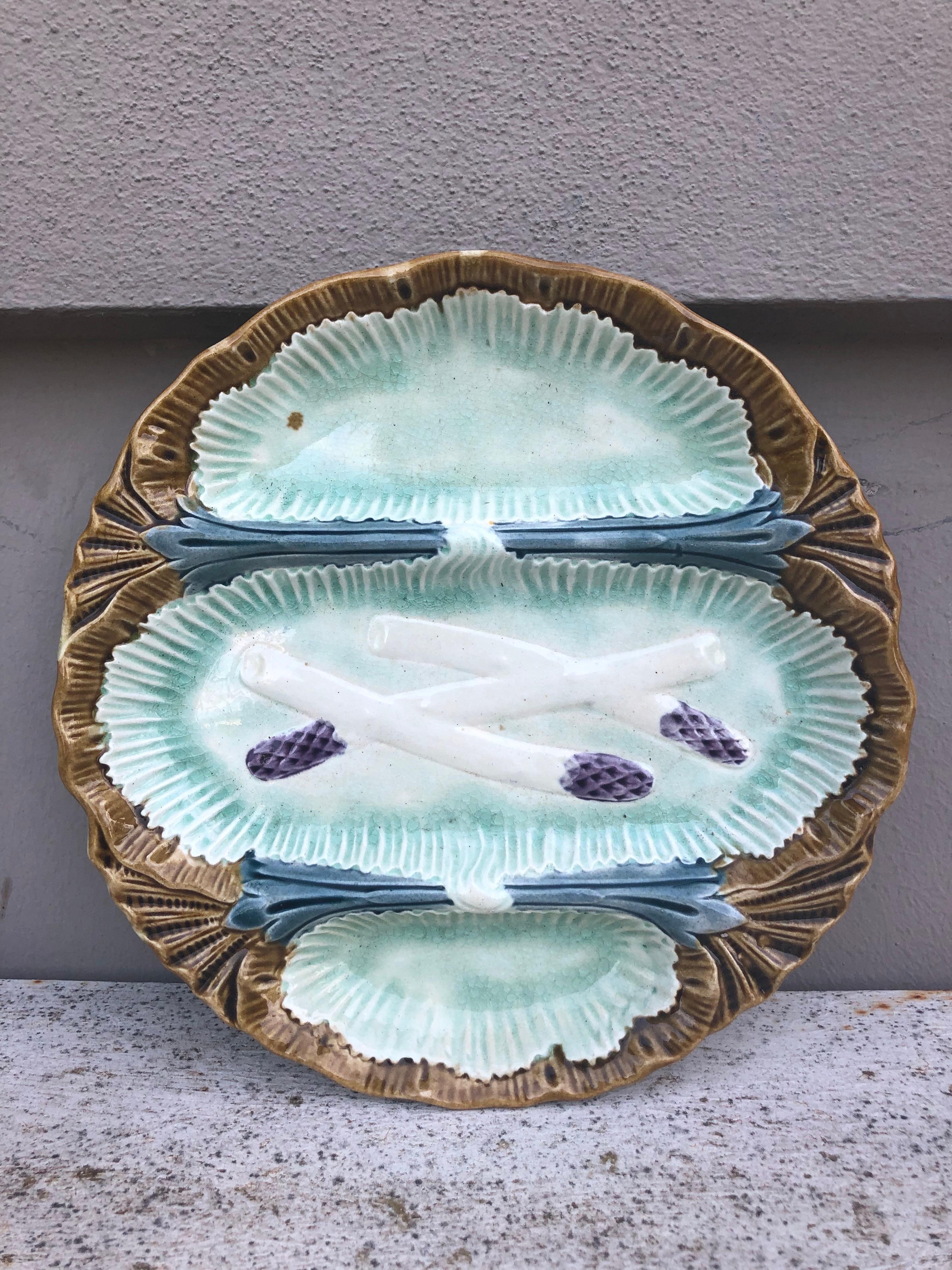 Unusual French Majolica asparagus plate with 3 spaces unsigned attributed to Orchies, circa 1890.