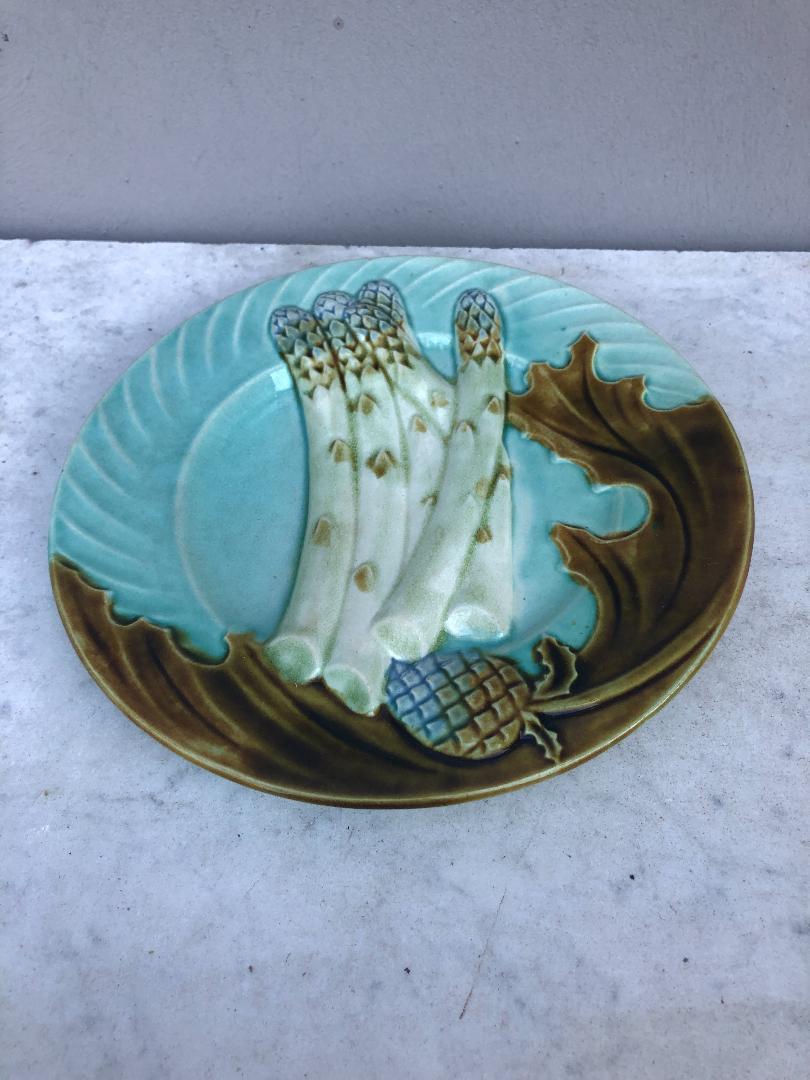 French Majolica asparagus plate signed Salins on a blue background, circa 1890.
 