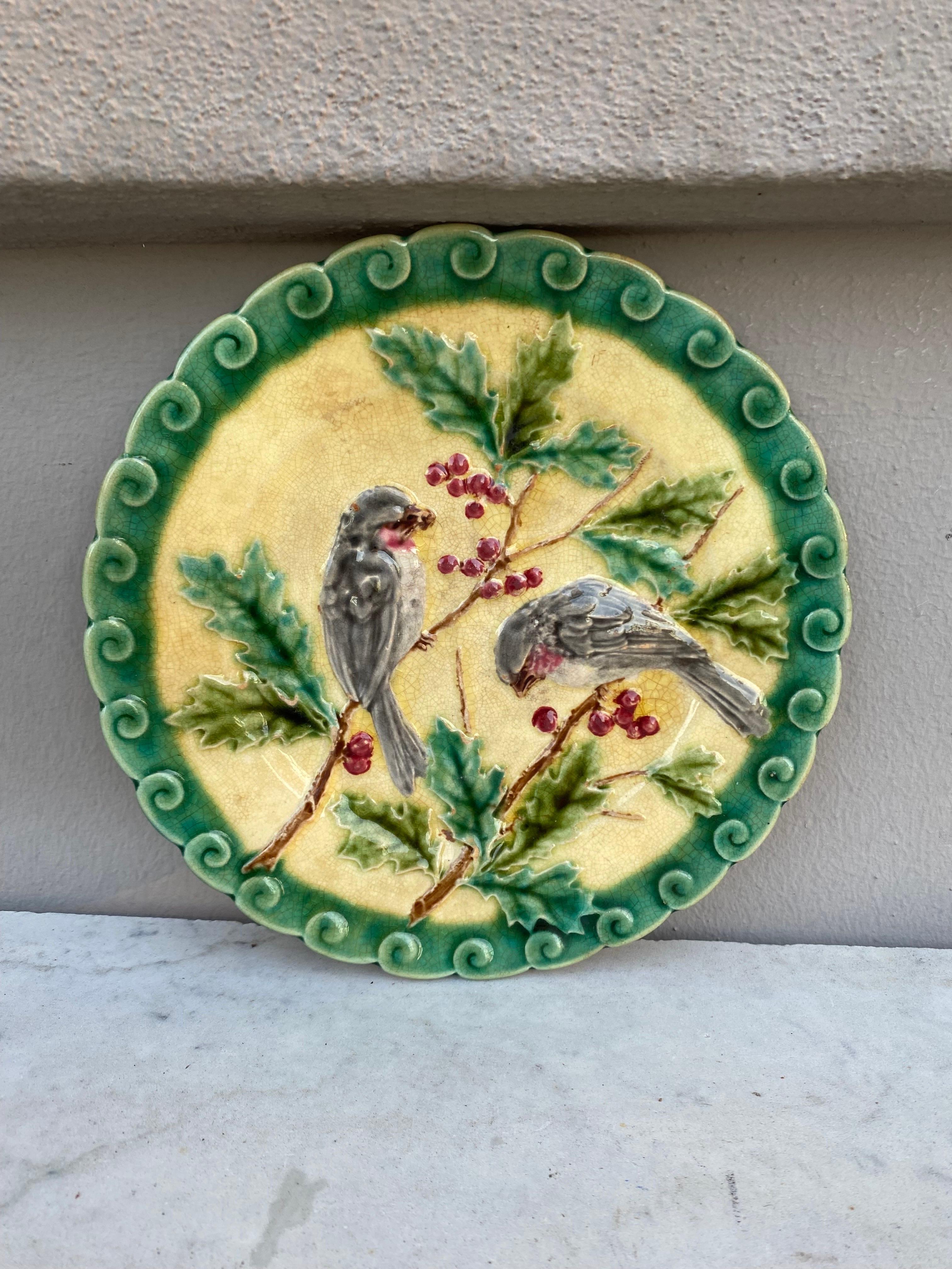 French Majolica bird with holly plate signed Sarreguemines, circa 1880.