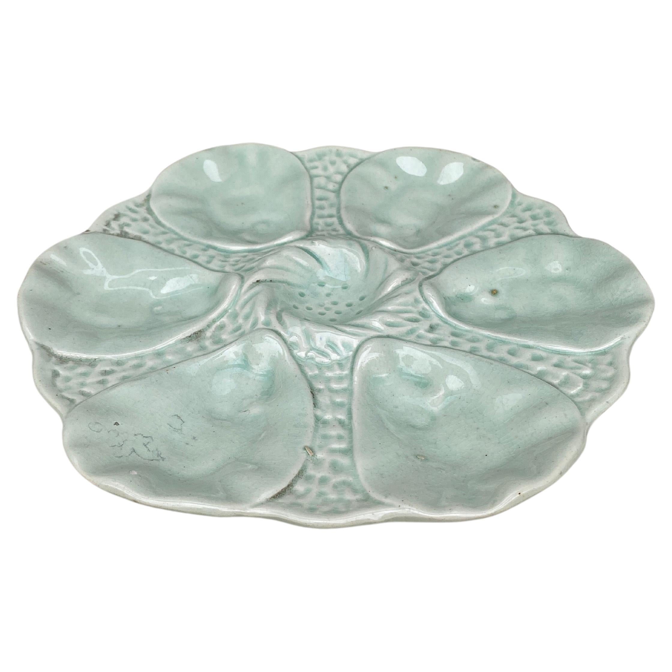 French Majolica oyster plate Orchies, circa 1910.
Celadon color.