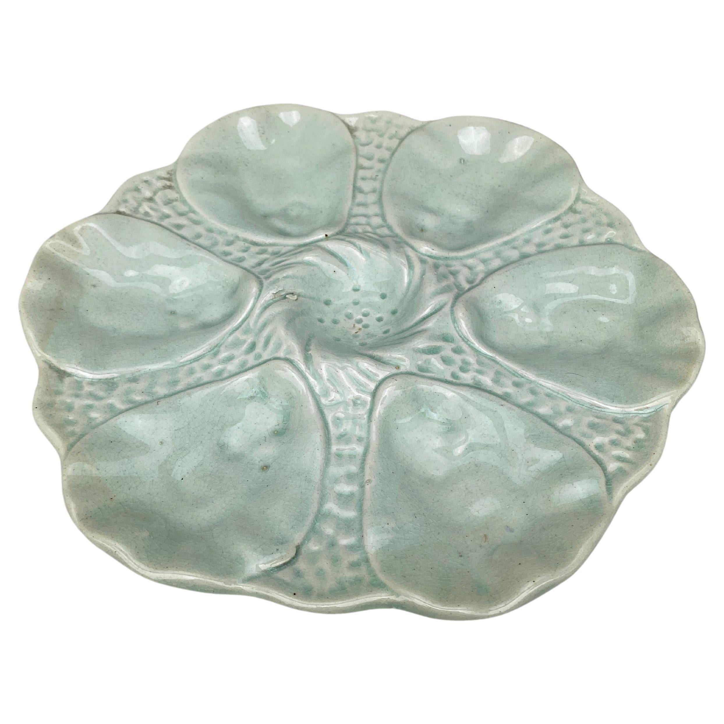French Majolica oyster plate Orchies, circa 1910.
Celadon color.