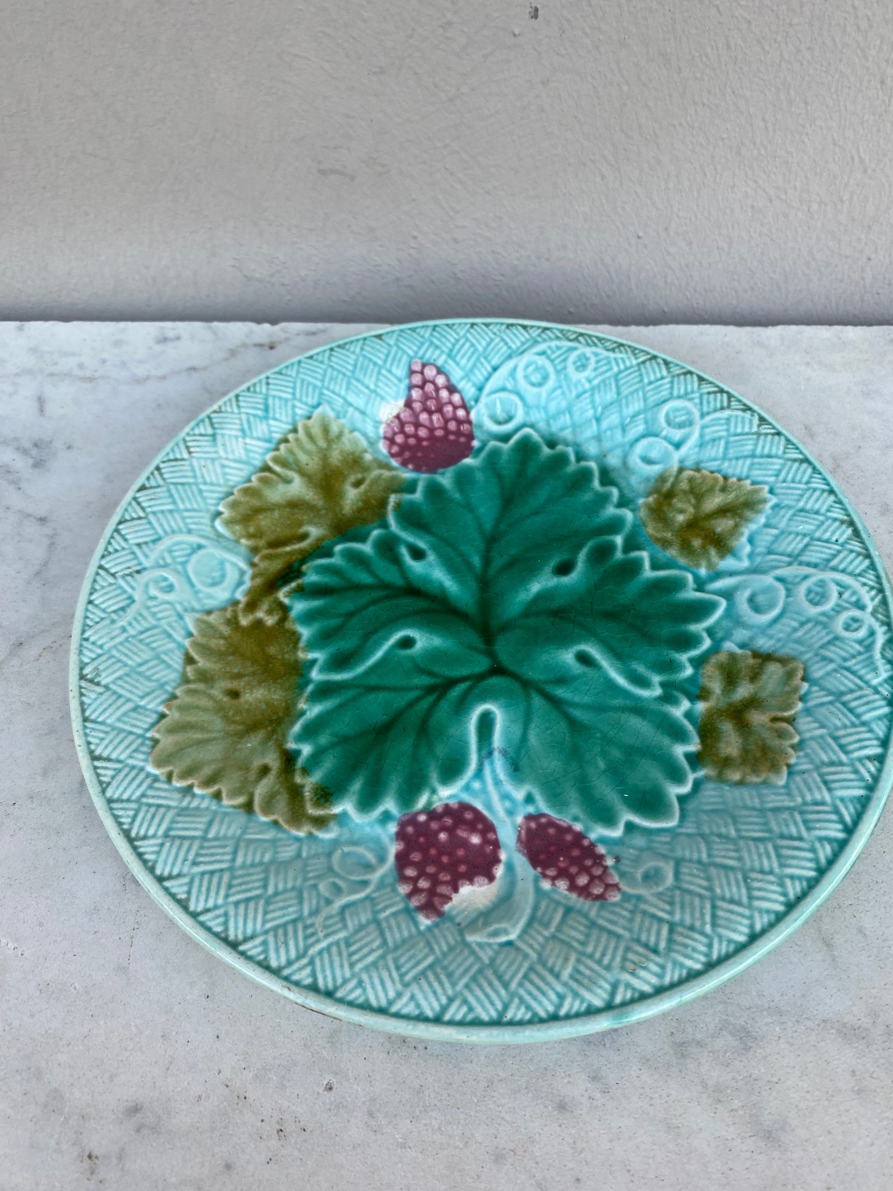 French Majolica grapes plate Salins on a light blue background (East of France), circa 1890.