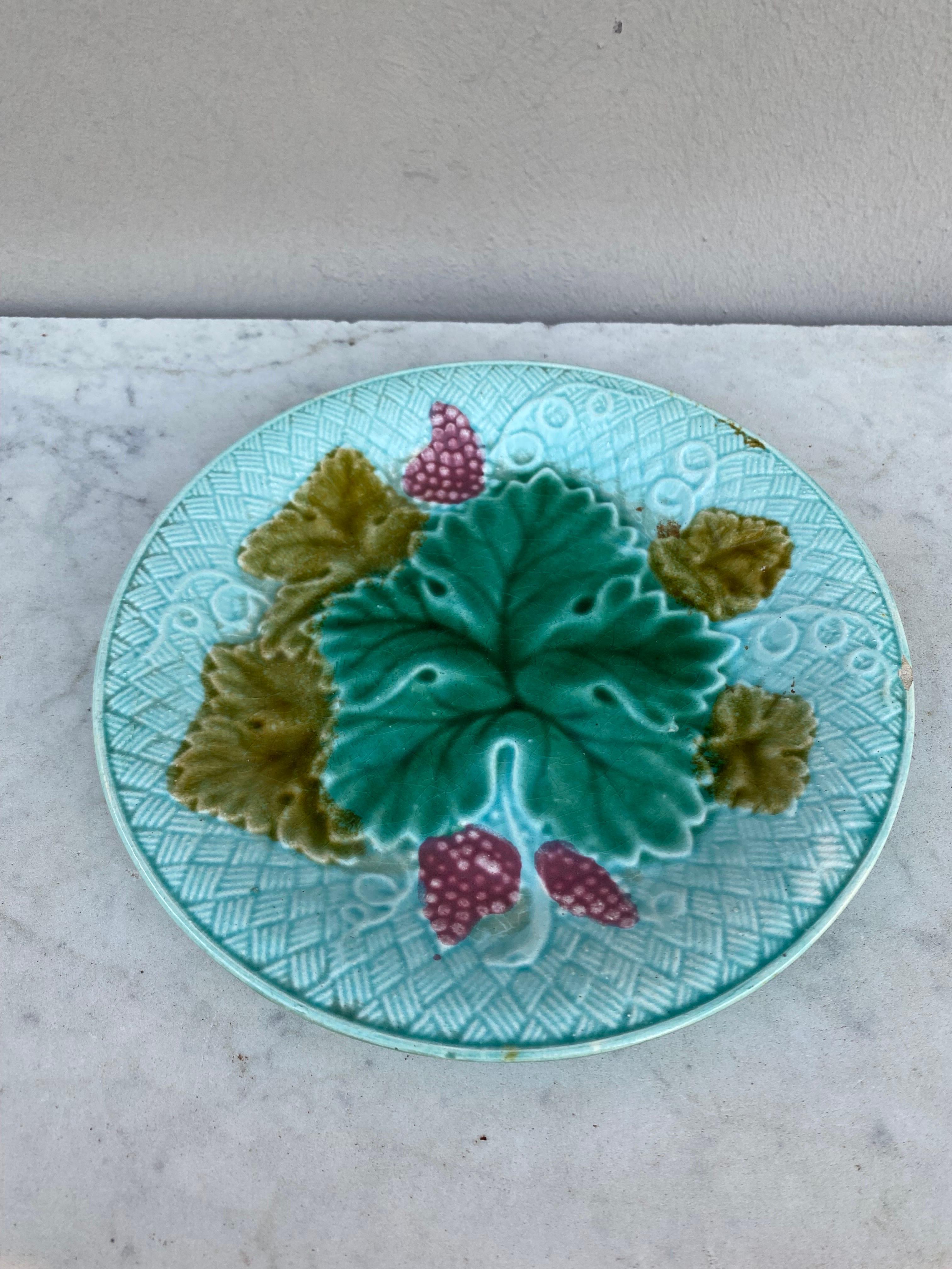 French Majolica grapes plate Salins on a light blue background (East of France), circa 1890.