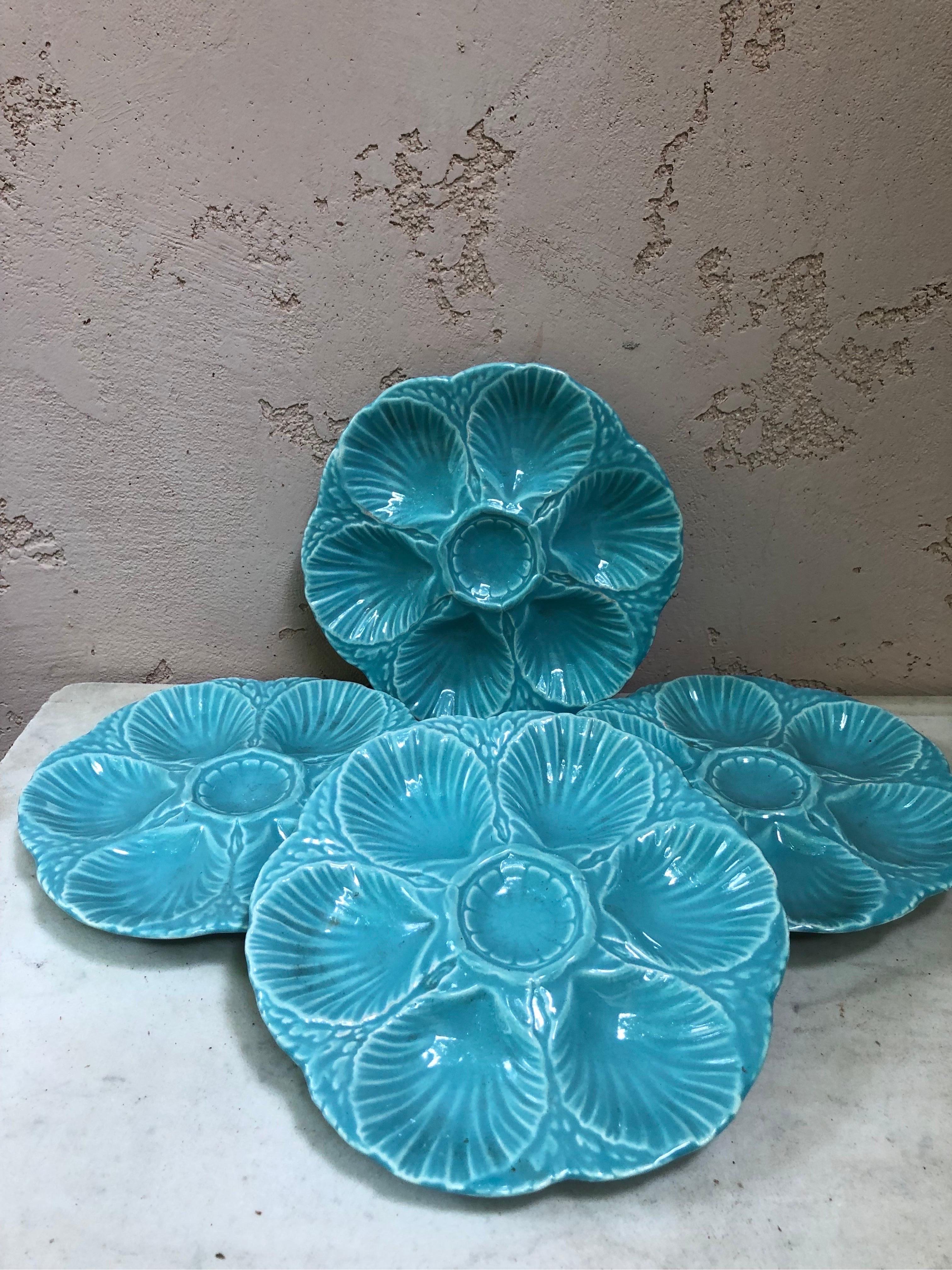 French aqua turquoise Majolica oyster plate signed Sarreguemines Majolica, circa 1870.
6 shells and space for the lemon on the center.
4 plates available.