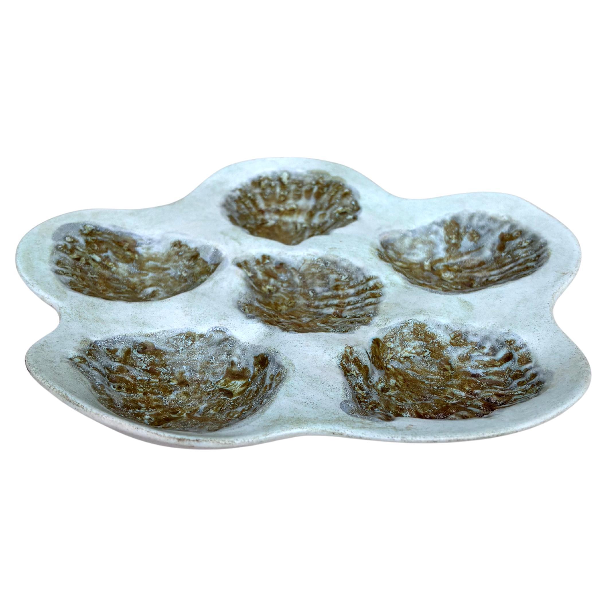 Large French Majolica oyster signed Marcel Guillot Vallauris, circa 1950.
10.5 diameter.