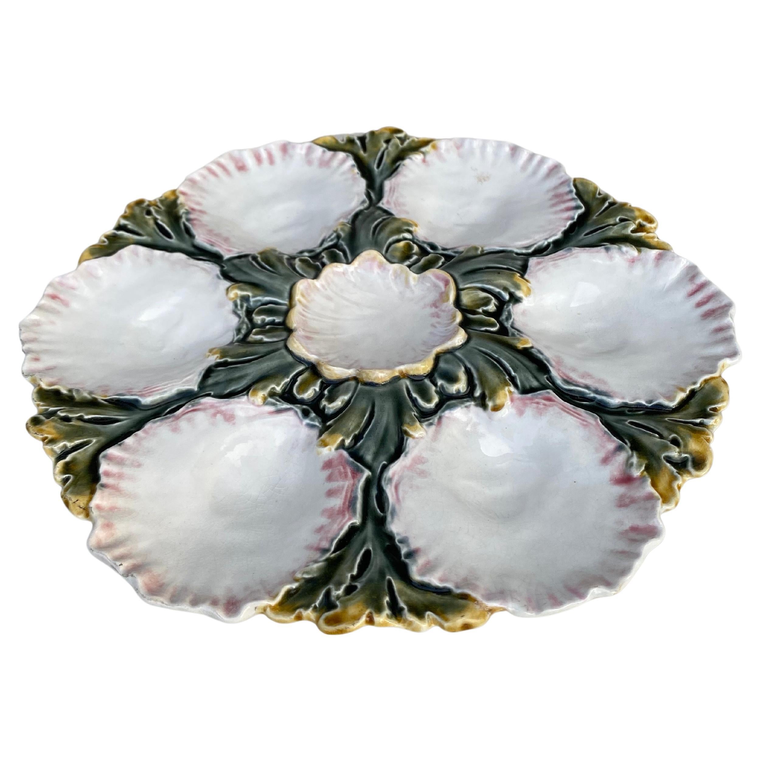 French Majolica oyster plate with green leaves, circa 1890.