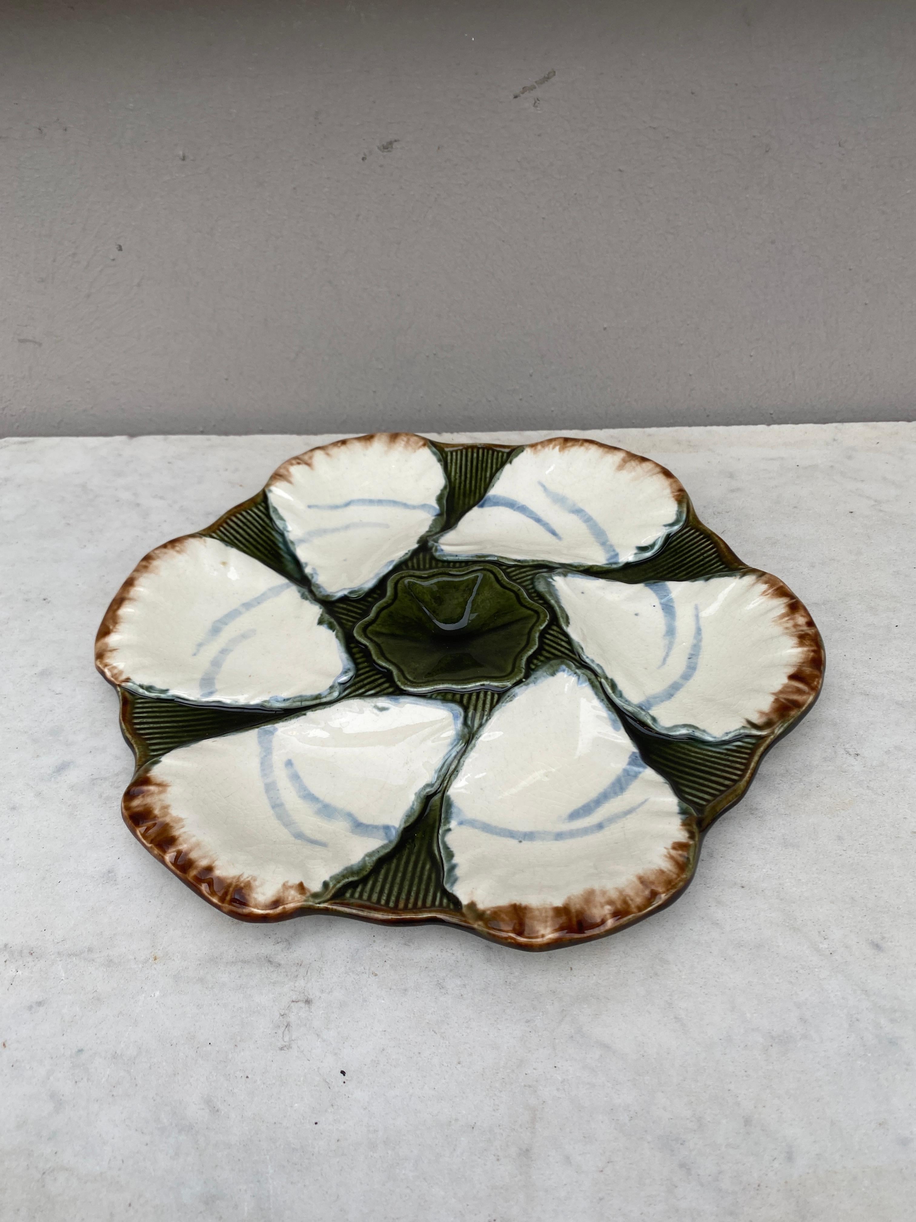 French Majolica oyster plate signed Longchamp, circa 1900.