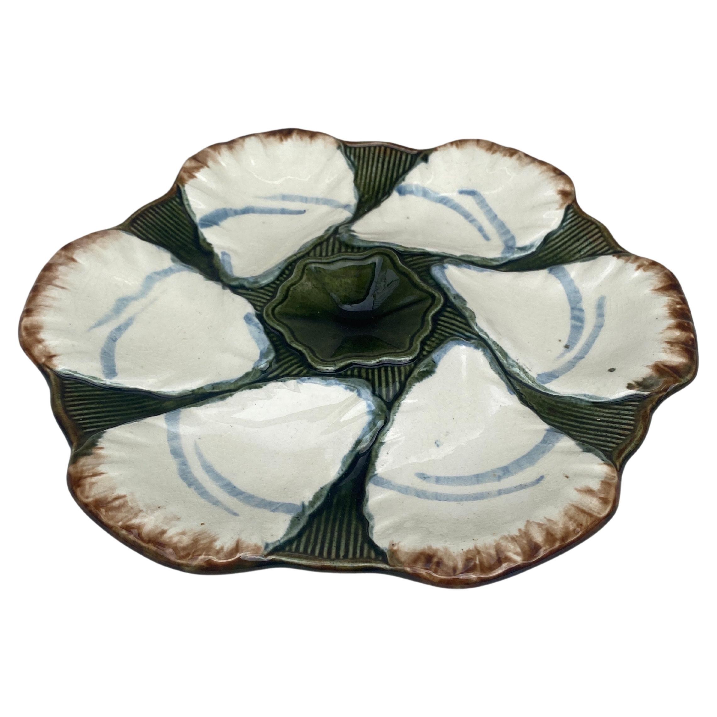 French Majolica oyster plate signed Longchamp, circa 1900.