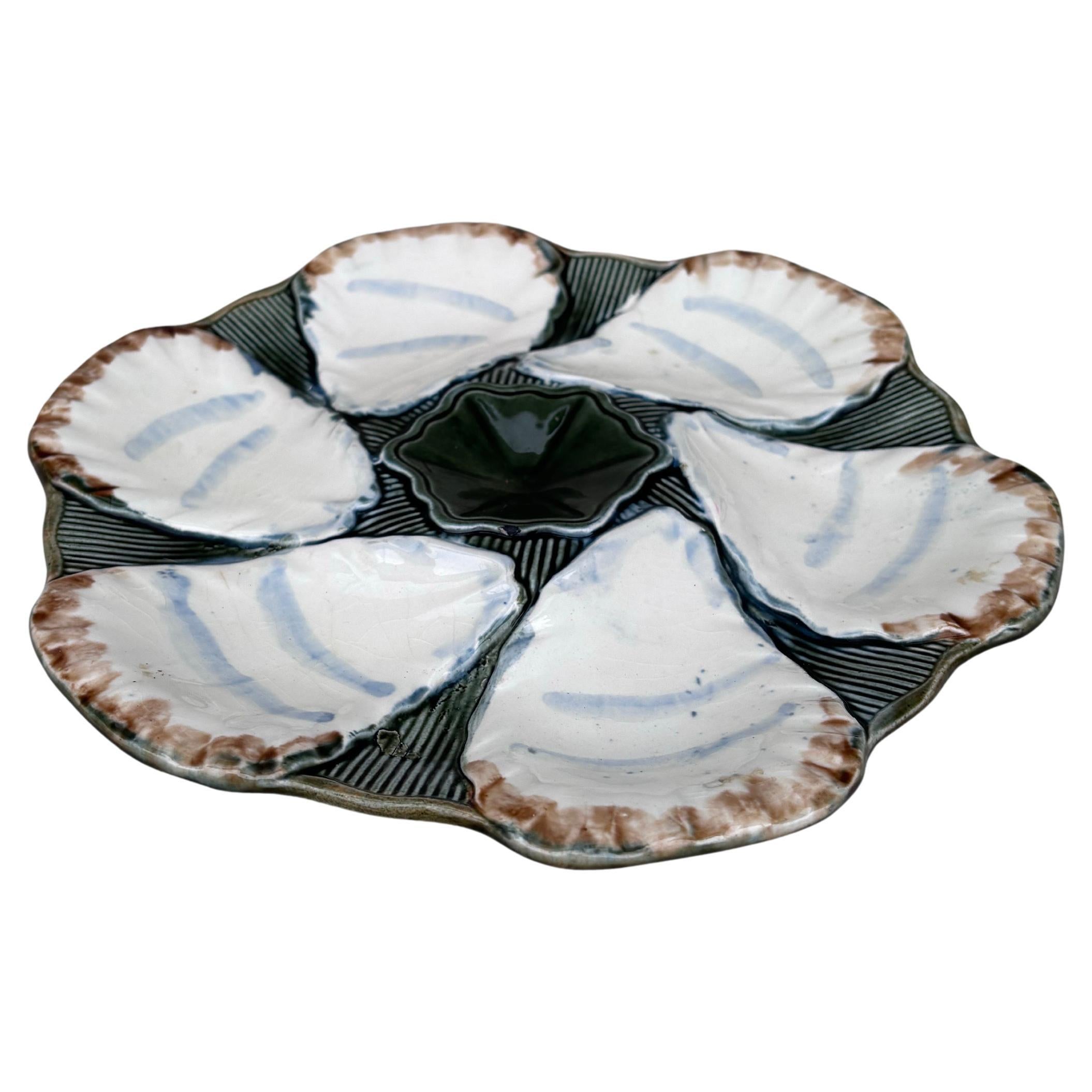 French Majolica oyster plate signed Longchamp, circa 1900.