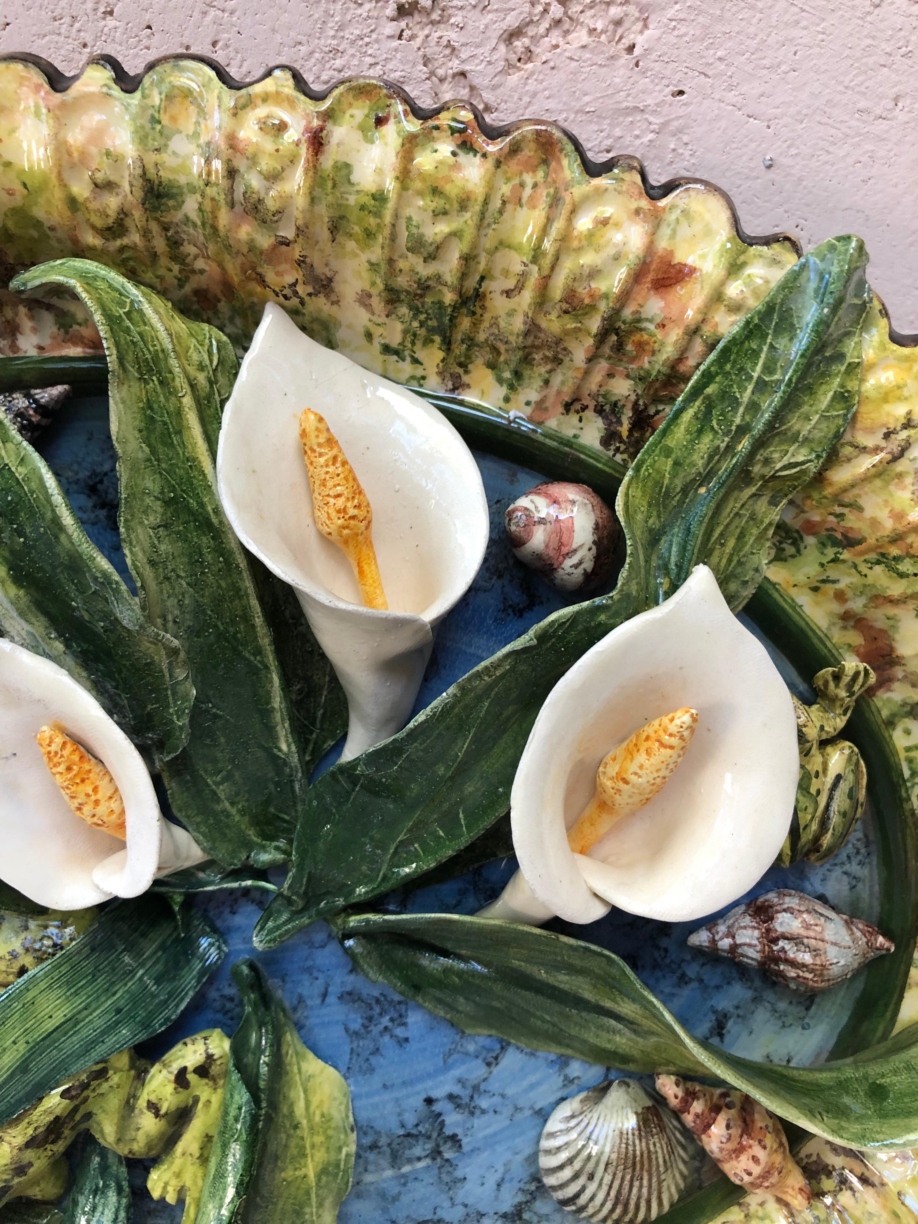 Rare Majolica platter arums, frogs, shells signed Christine Viennet circa 2000.
Christine Viennet studied at the Oslo school of art, then apprenticed for two Norwegian artists, Rolf Hansen and Bente von Krogh. Between 1965 and 1971, she worked with