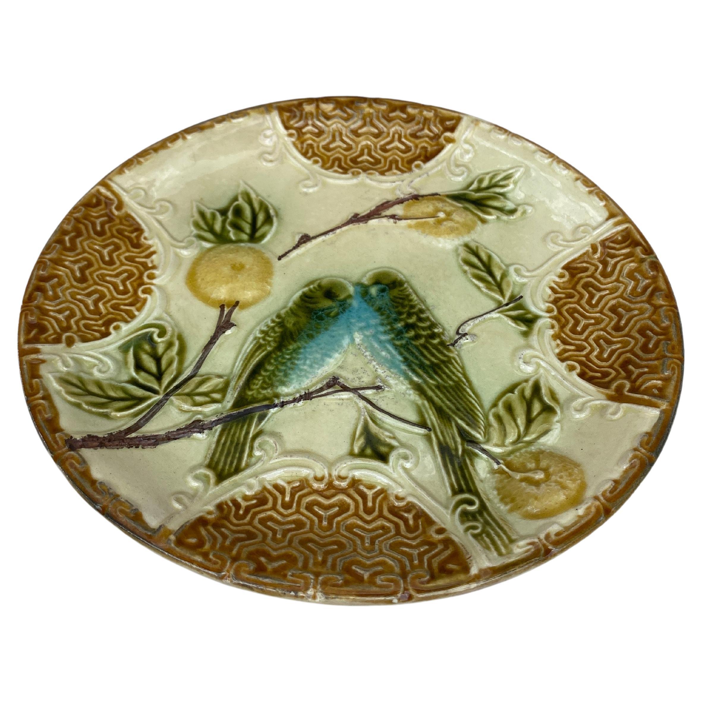 Majolica plate two parakeets with oranges Salins, circa 1890.

 