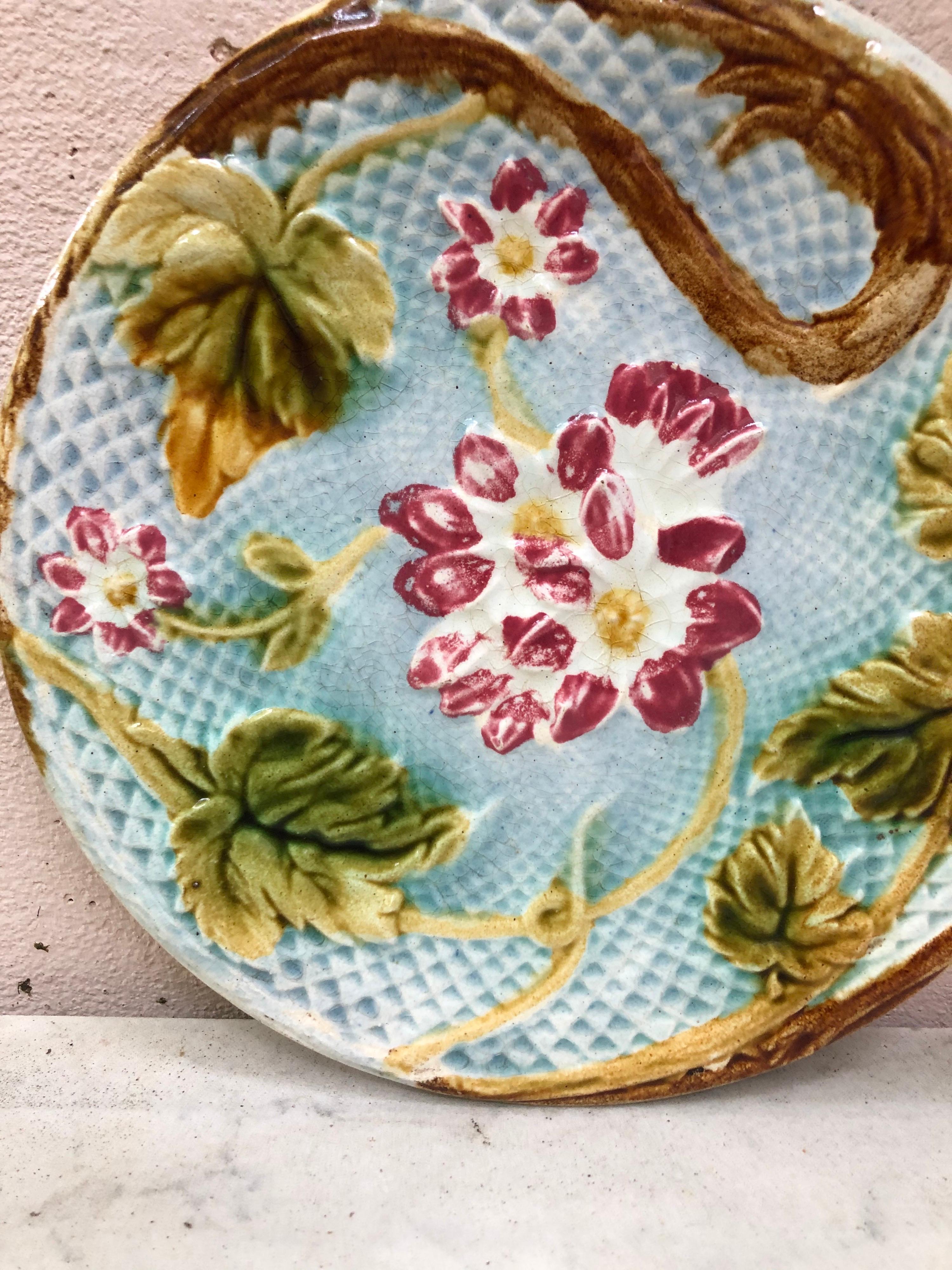 Lovely French Majolica plate pink flowers on a blue basket weave, circa 1880 attributed to Salins.