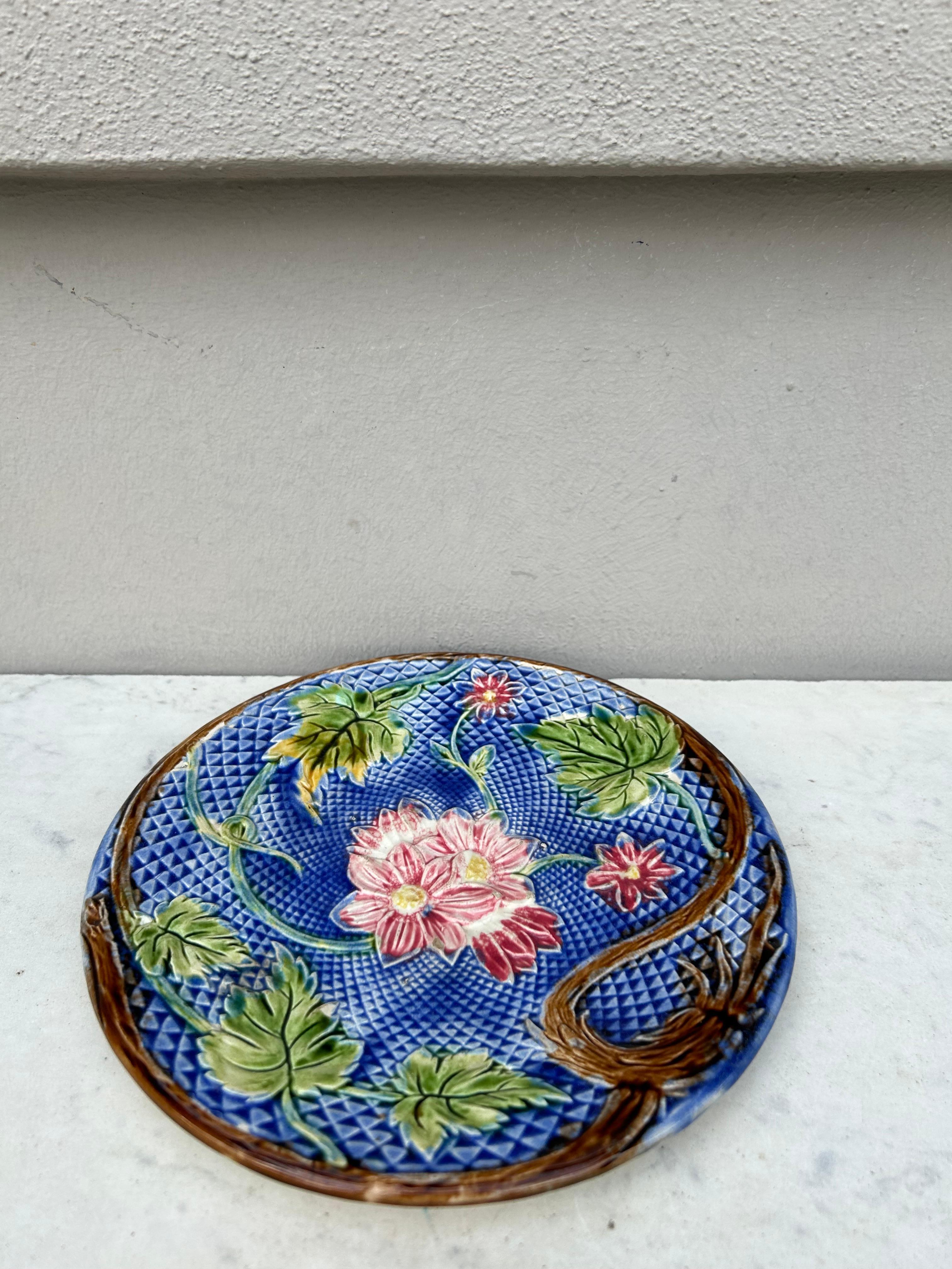 Lovely French Majolica plate pink flowers on a blue basket weave, circa 1880 attributed to Salins.
Very rare color.
