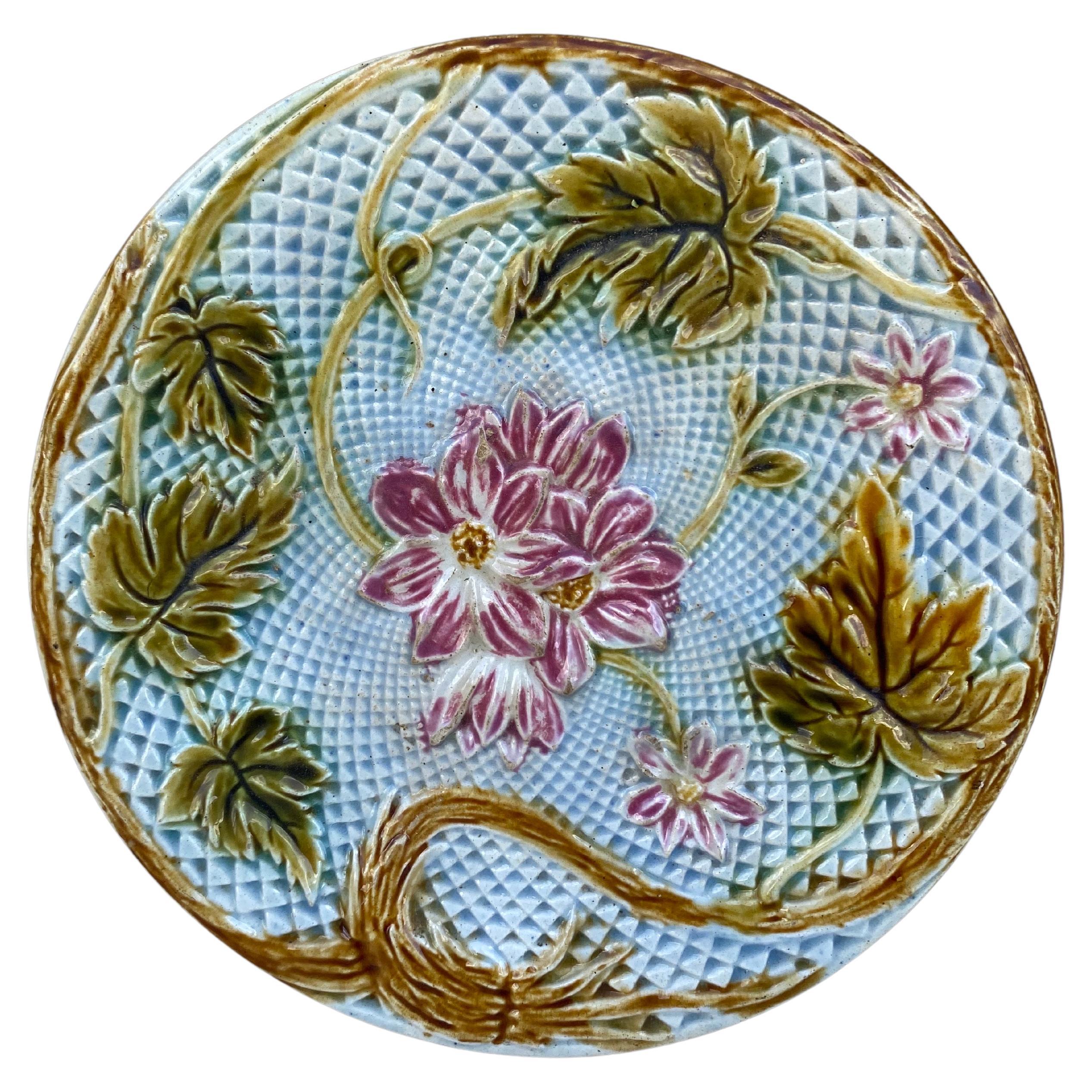 Lovely French Majolica plate pink flowers on a blue basket weave, circa 1880 attributed to Salins.
