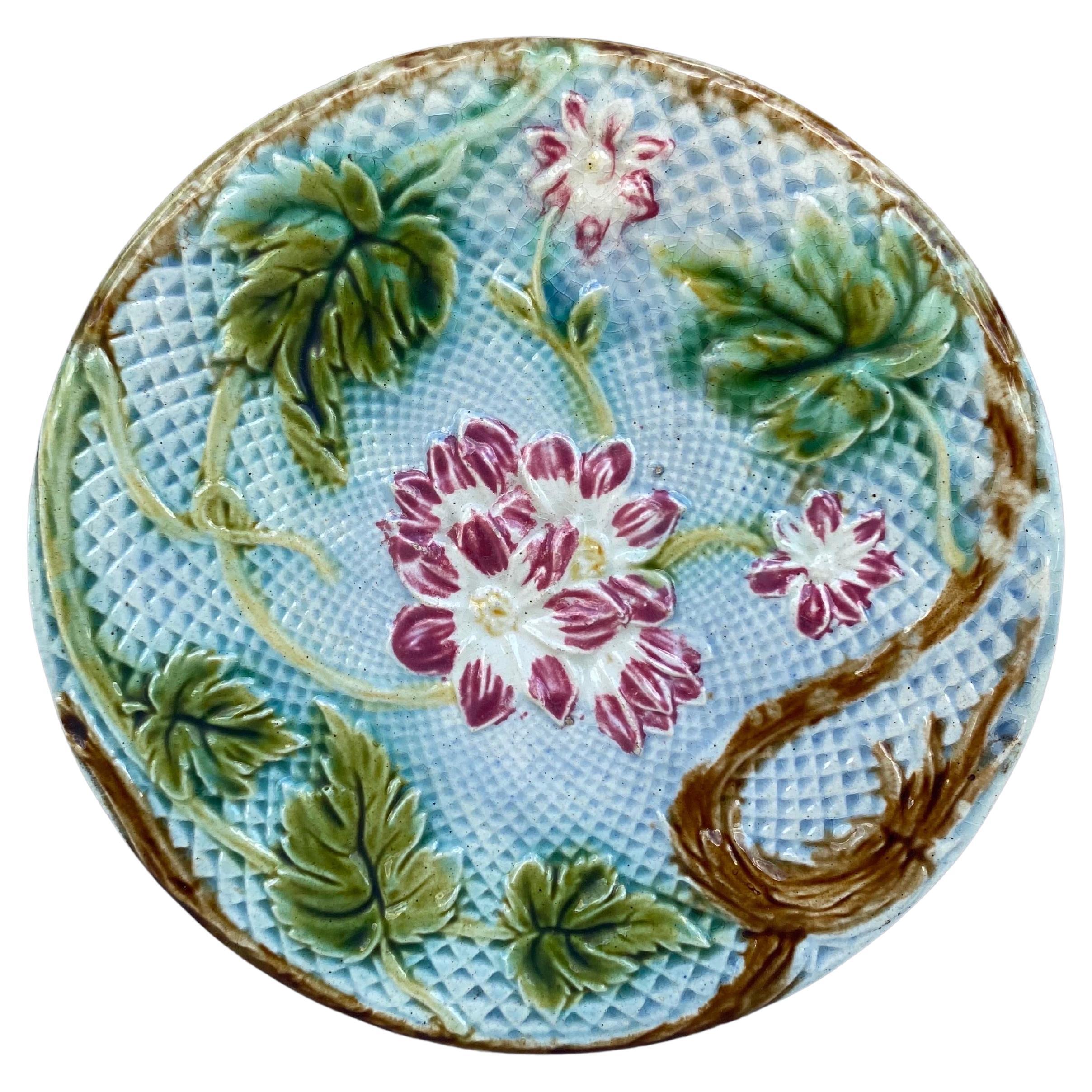 Lovely French Majolica plate pink flowers on a blue basket weave, circa 1880 attributed to Salins.