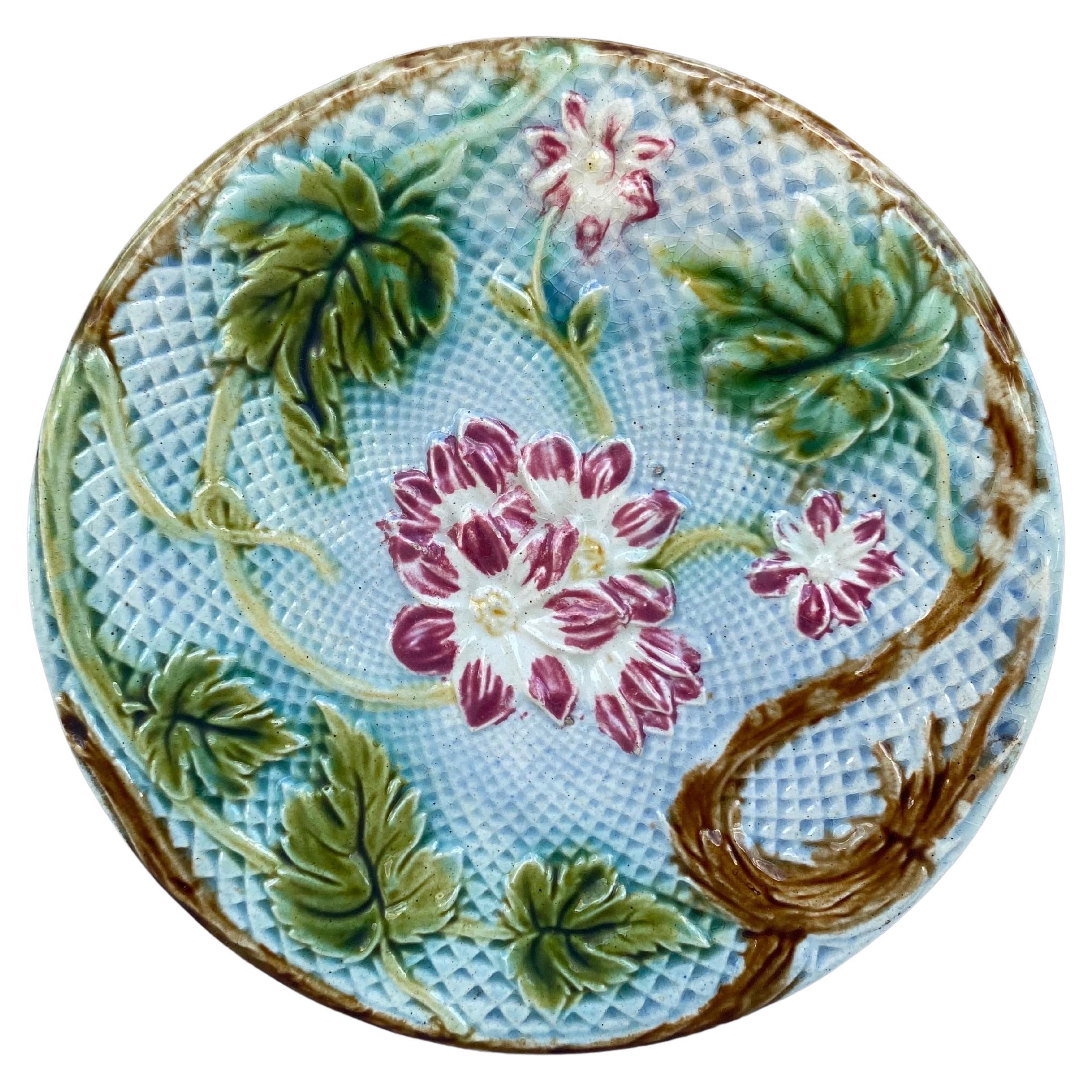 Lovely French Majolica plate pink flowers on a blue basket weave, circa 1880 attributed to Salins.