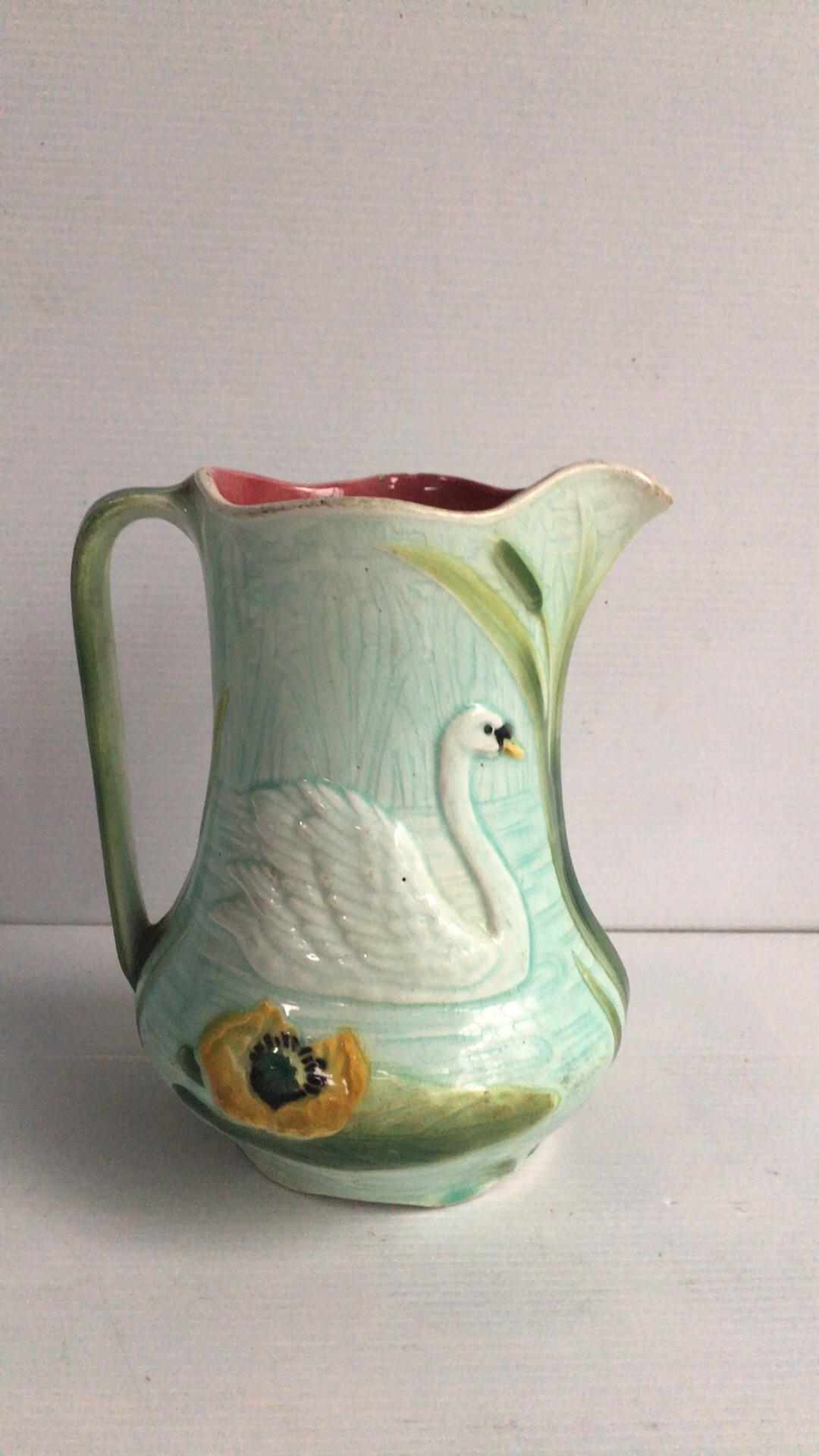 French Majolica pitcher with swan and water lilies Keller & Guerin Saint Clément, circa 1900.
Measures: Height 6.8 inches, length 6