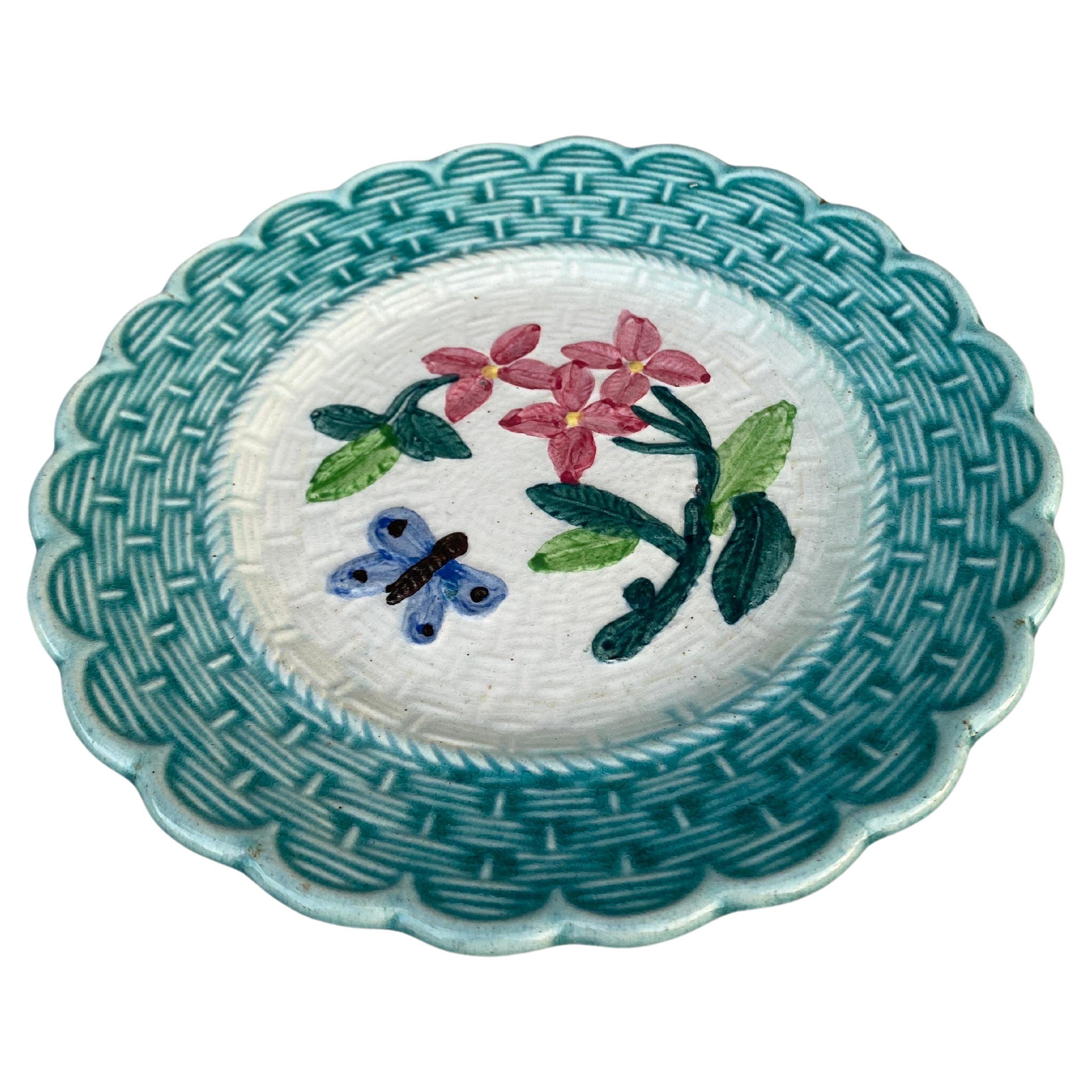French majolica plate with flowers & butterfly, Circa 1900.