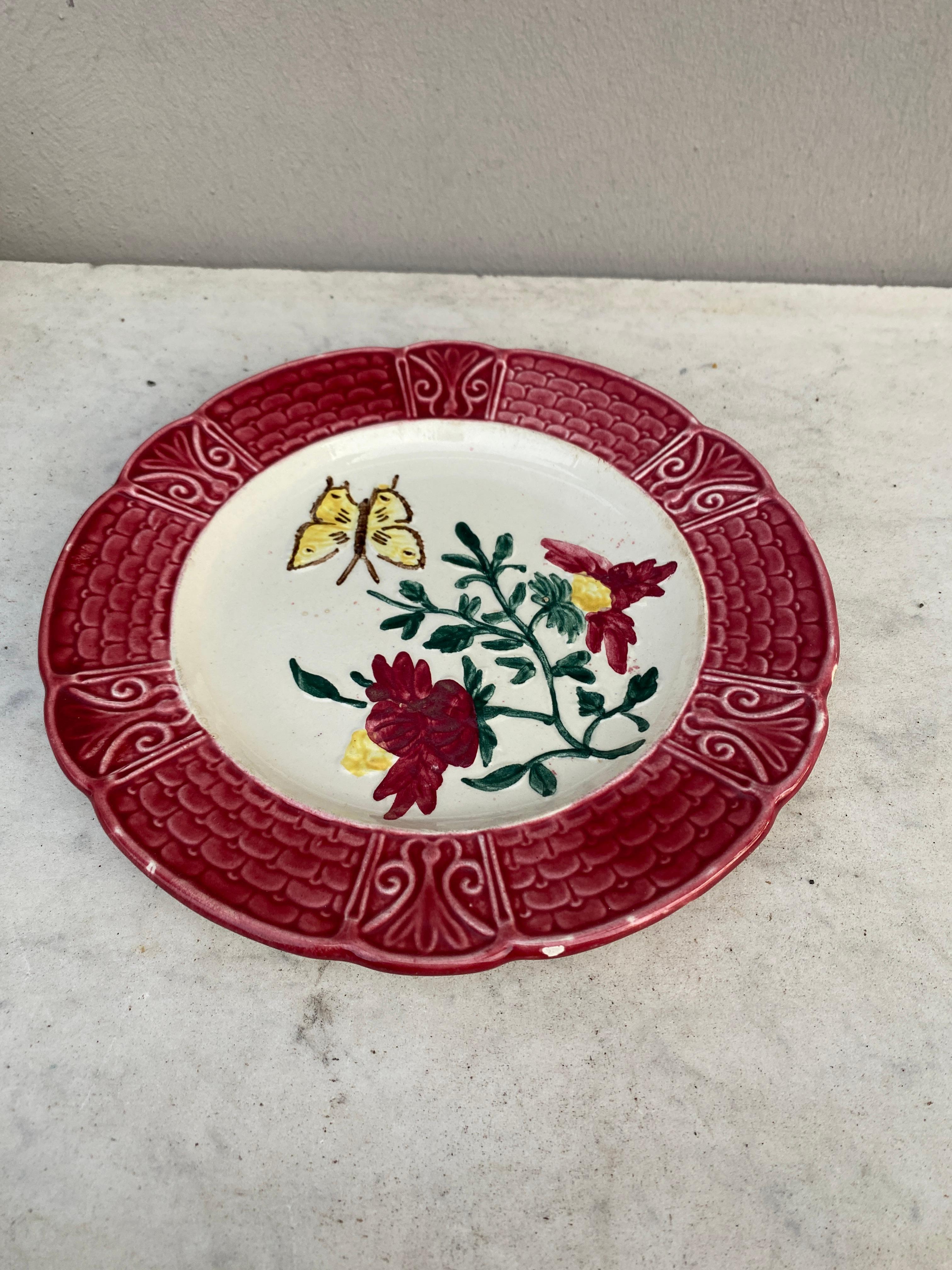 Rustic French Majolica Plate with Flowers & Butterfly, circa 1900 For Sale