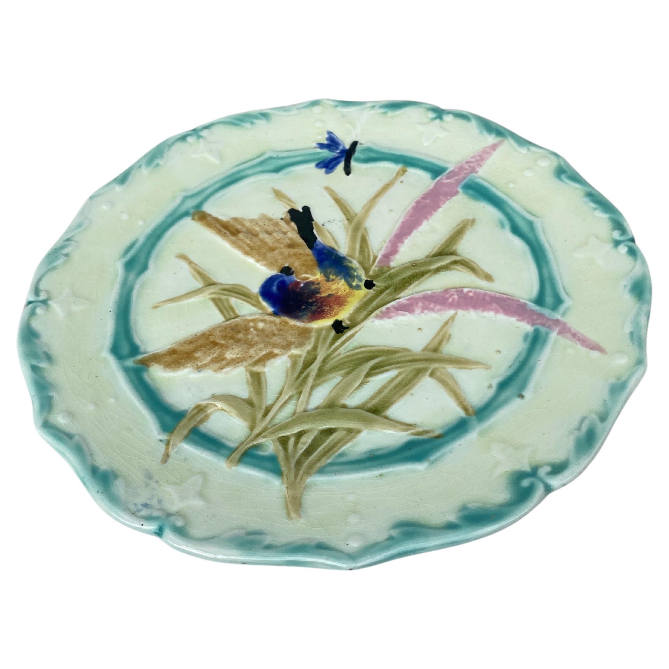 Lovely Majolica plate with bird and insect, leaves signed Saint Amand, circa 1890.