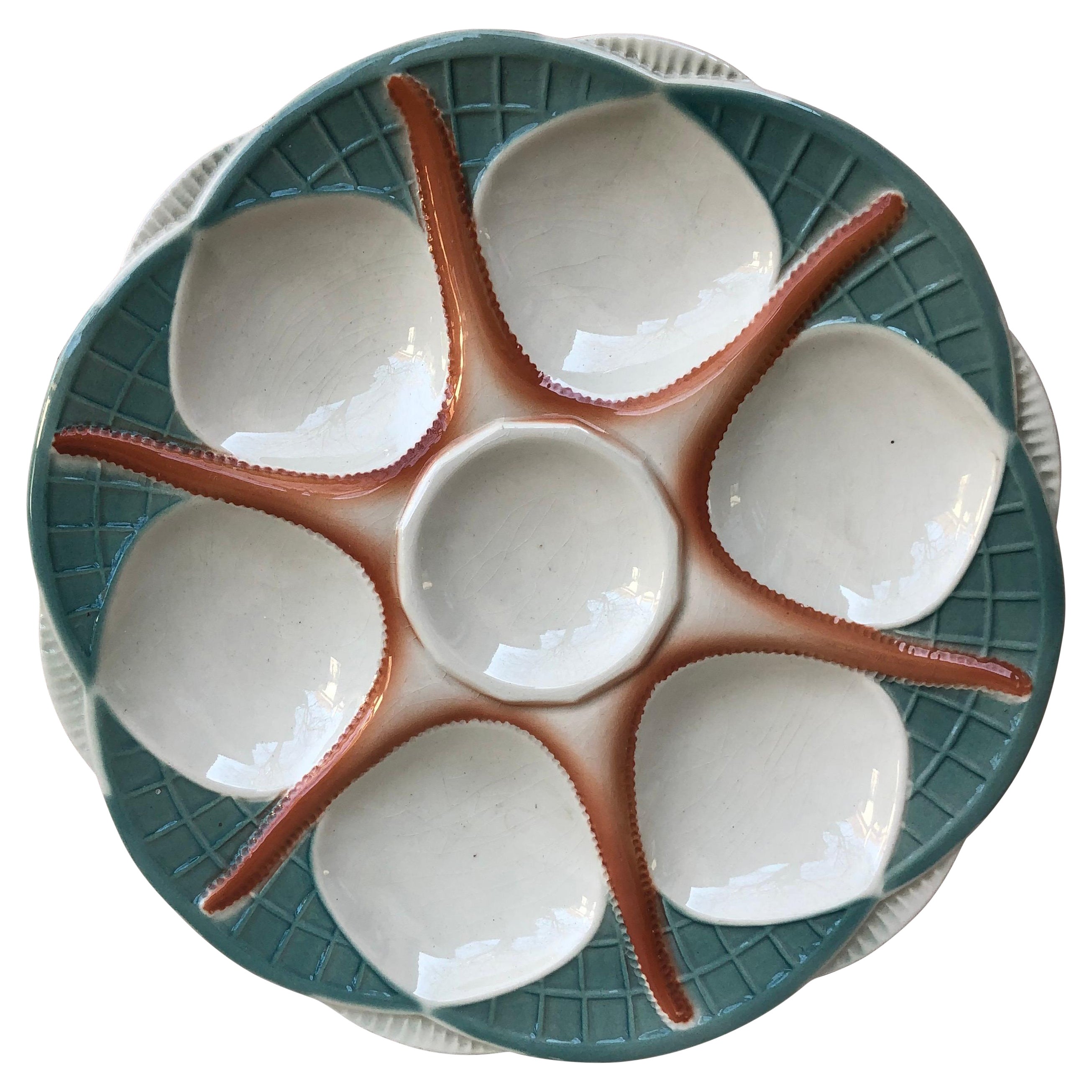 Assiette à huîtres en forme d'étoile de mer en majolique française Digoin Sarreguemines, vers 1920