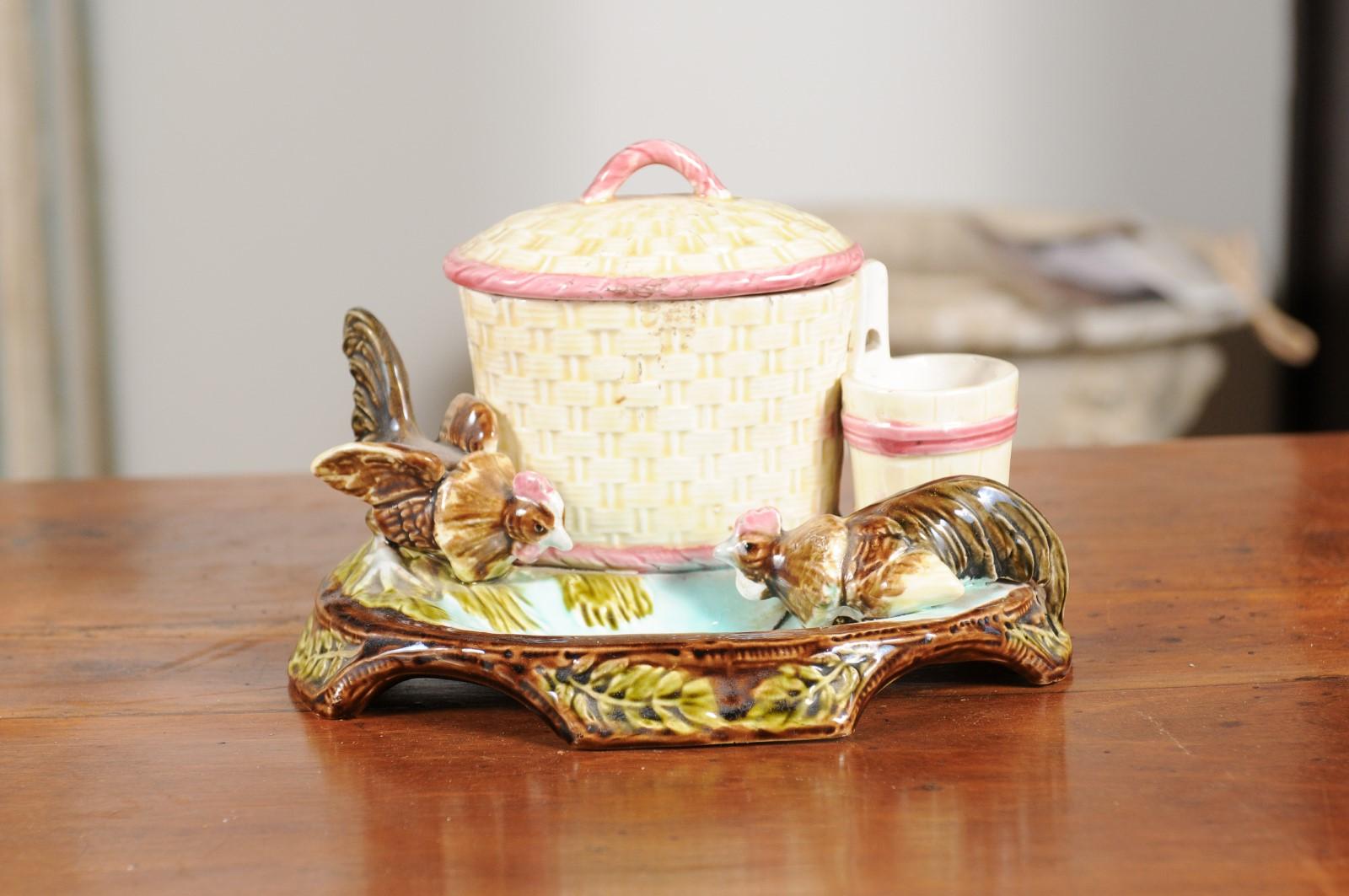 An Austrian Eichwald majolica humidor tobacco jar from the late 19th century, with petite roosters pecking the ground. Created in Austria during the third quarter of the 19th century, this lovely tobacco jar called a humidor features a central