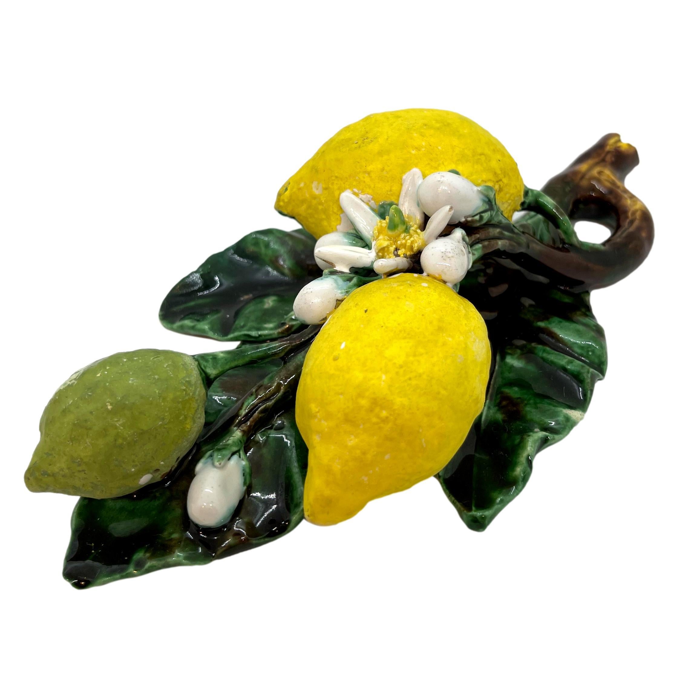 Menton French Majolica (Barbotine) Trompe L'oeil Wall Plaque with lemons molded in high relief, circa 1880. 
Generally referred to as 