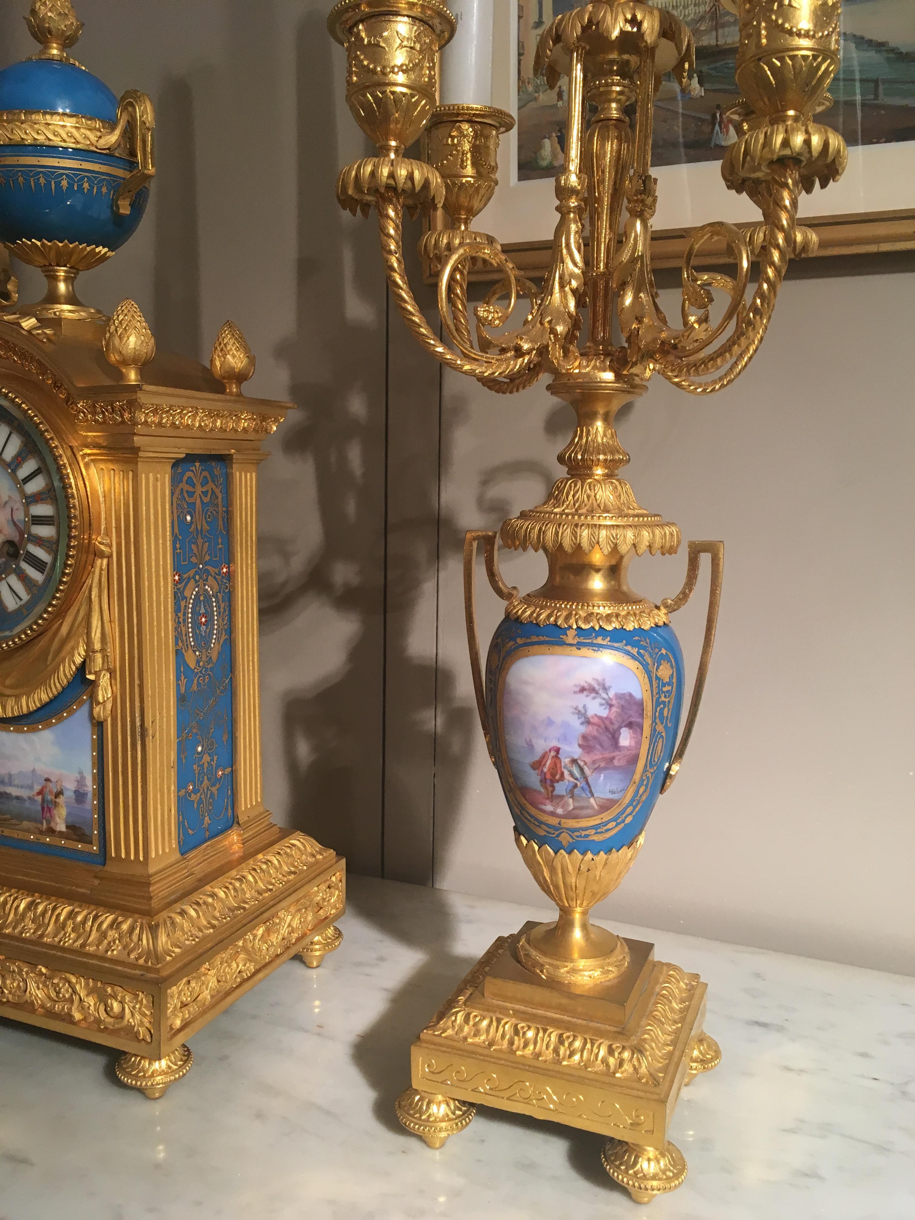 French Mantel Clock and Candelabra of Gilt Bronze and Blue ‘Sèvres’ Porcelain In Good Condition For Sale In London, GB