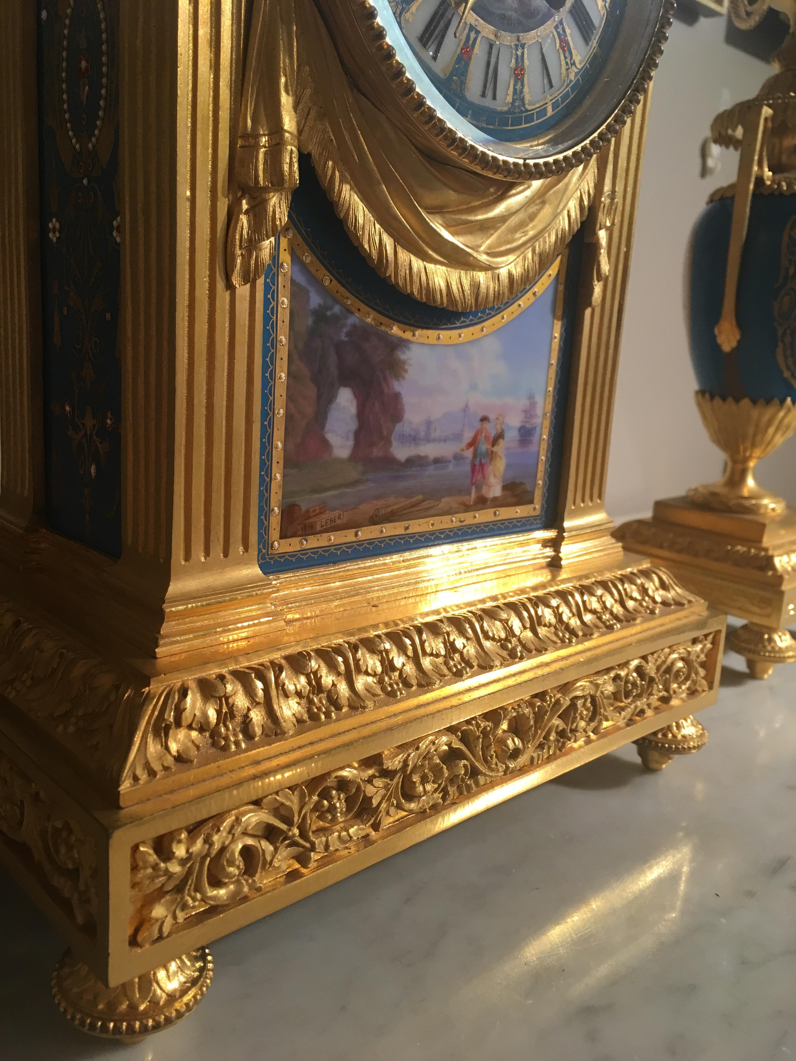19th Century French Mantel Clock and Candelabra of Gilt Bronze and Blue ‘Sèvres’ Porcelain For Sale