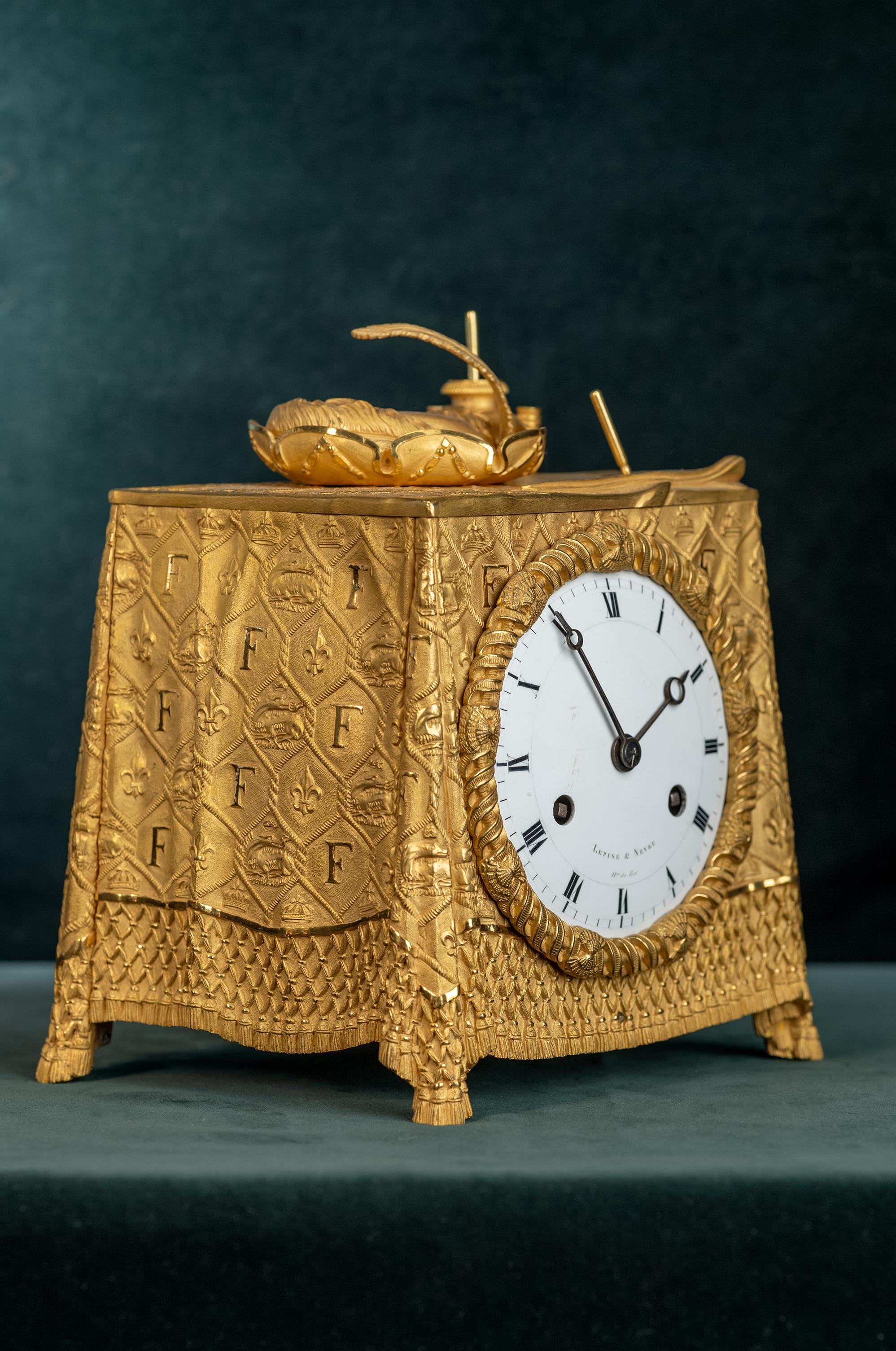 A gilded French mantel clock signed 