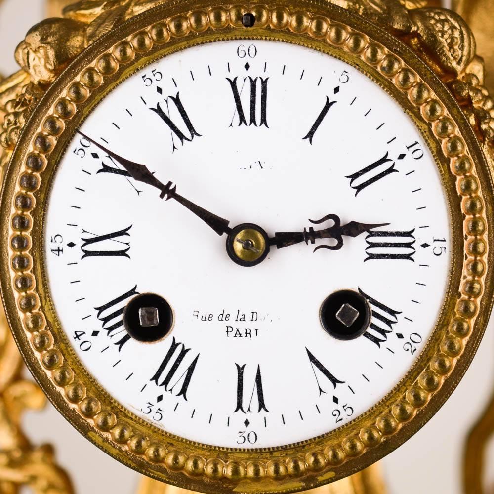 Large pendulum clock made in France in the 18th century by the Prevost workshop in Paris. In gilded bronze and alabaster plateau. The dial has Roman numerals. At his side, a young man holding a spear and elegantly dressed looks over the dial. The