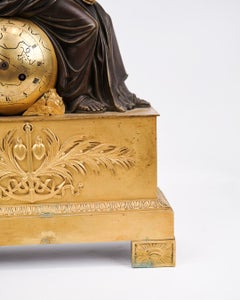 French Mantel Clock In Bronze Decorated With Female Figure In Empire Style