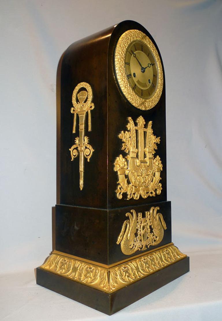 Attractive french Empire clock in patinated bronze and ormolu of milestone or 