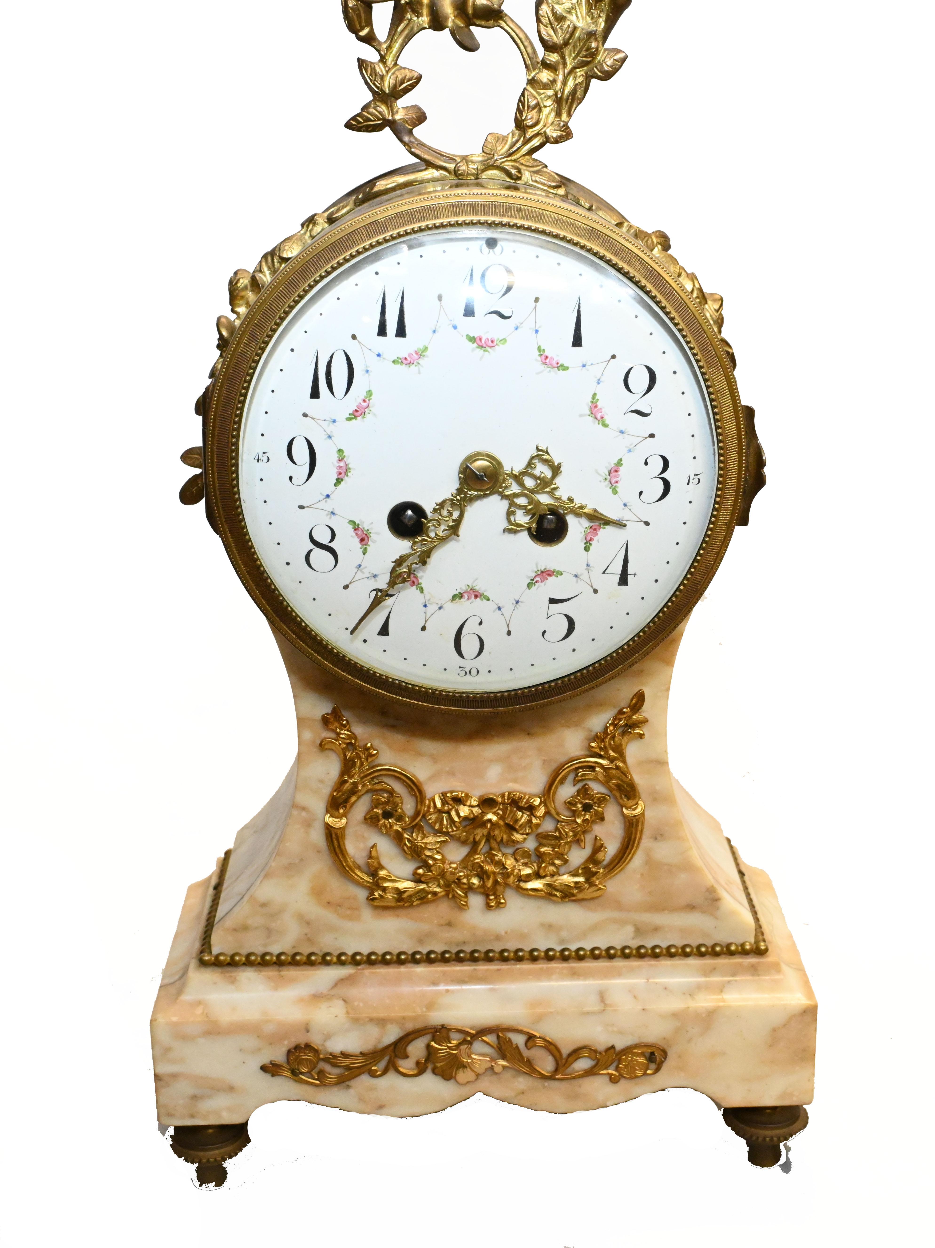 Gorgeous antique French mantle clock flanked by two matching urns
We date this set to circa 1880
Great piece, hand crafted from marble with ormolu fixtures
Bought from a dealer on Marche Biron at Paris antiques markets
Offered in great shape