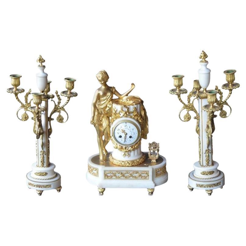 French Marble and Gilded Bronze Clock Set For Sale