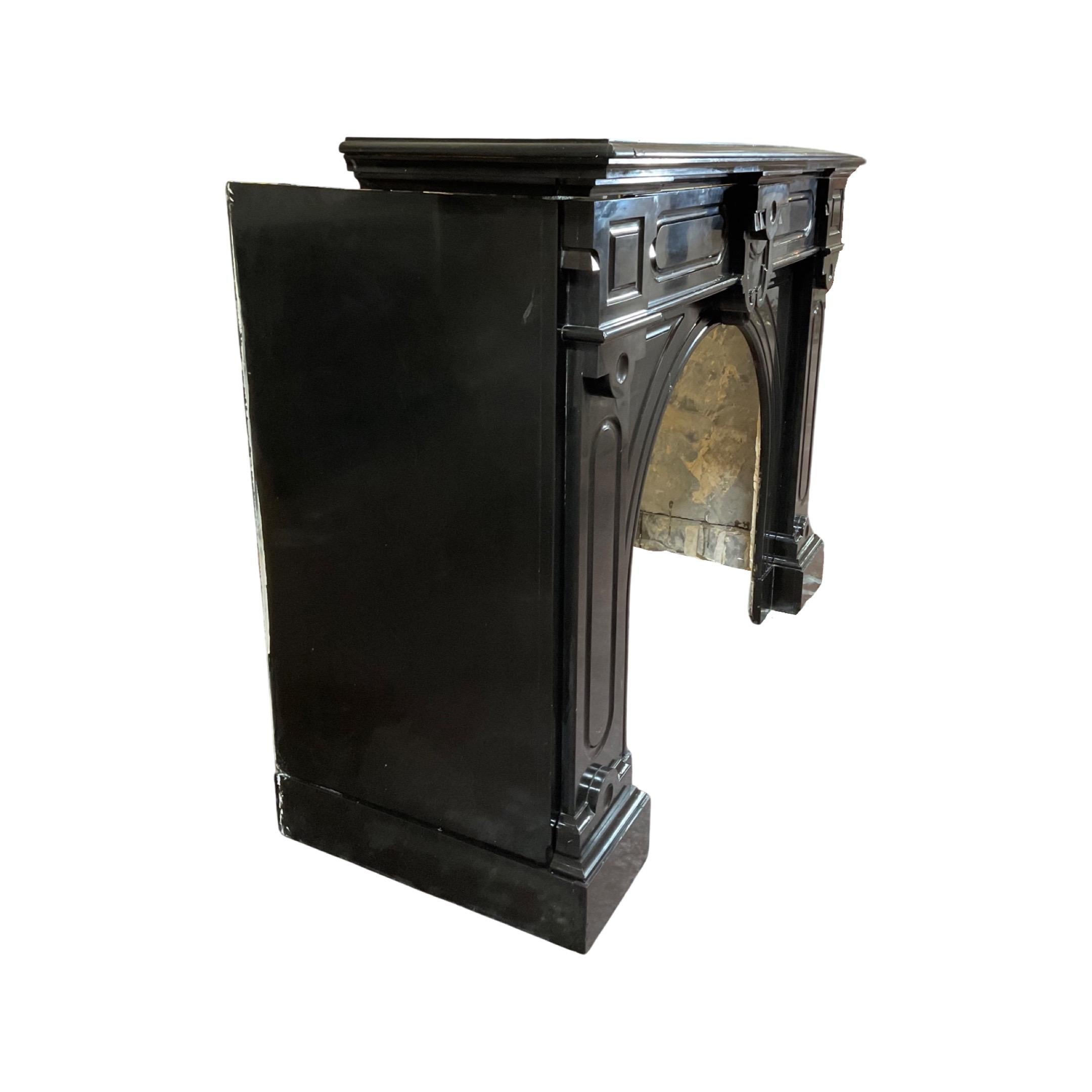 This unique piece of French craftsmanship is sure to make a statement in any home. The black marble mantel, inspired by the Louis XVI style of the 1880s, is a perfect addition for a fireplace. Its timeless design is sure to last many generations