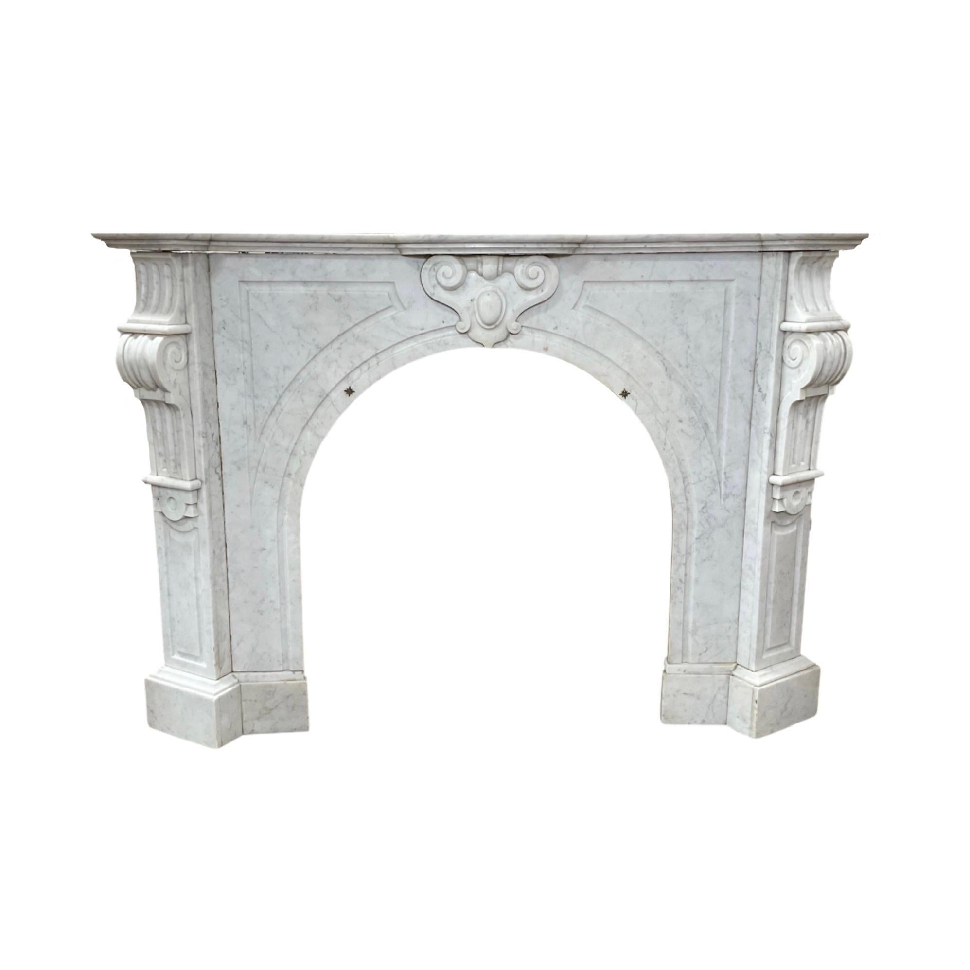 This classic French marble mantel from circa 1880 boasts a beautiful louis xvi style craftsmanship and is made with a luxurious white Carrara marble. Its timeless style will bring a touch of elegance to any space.