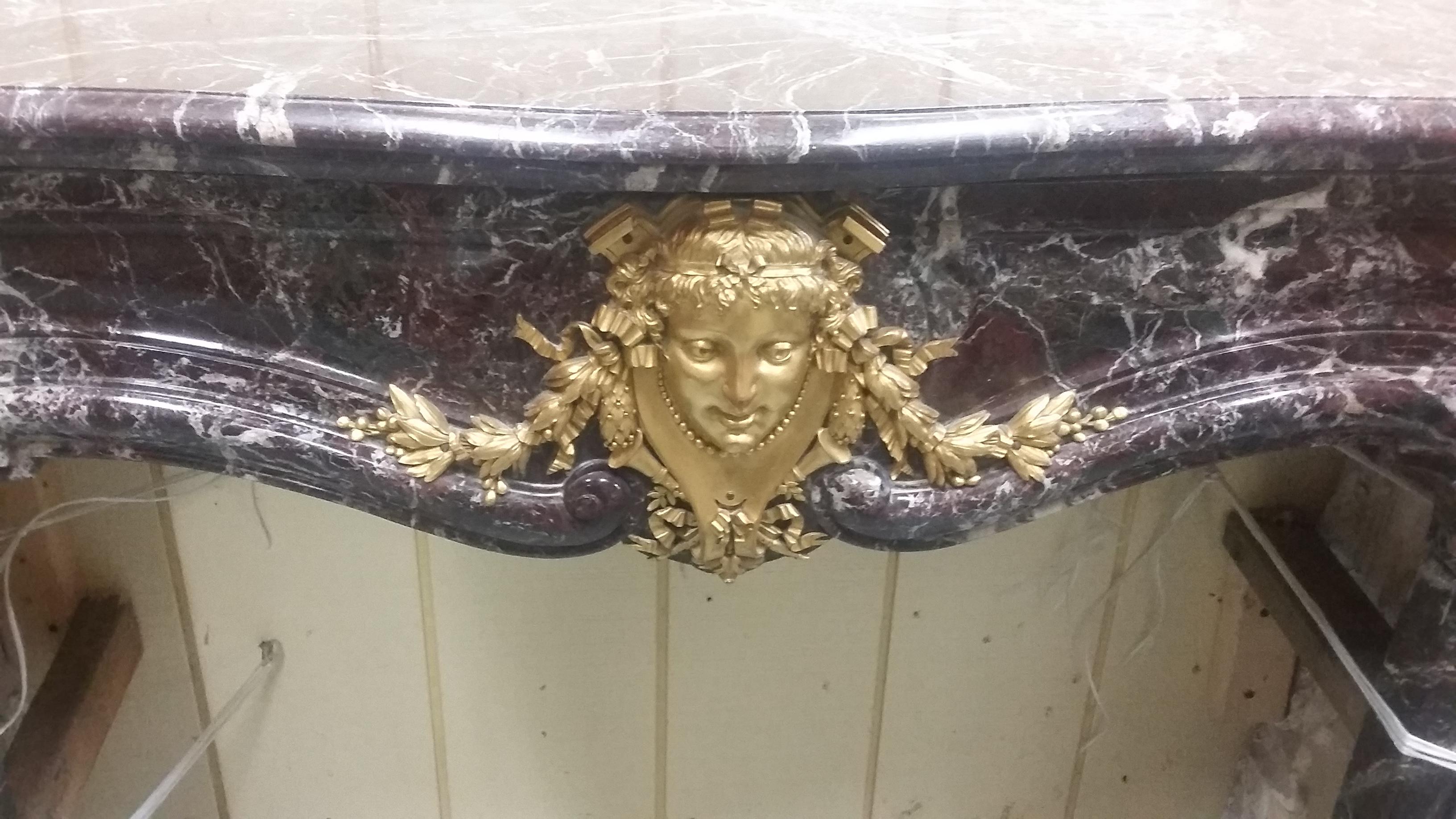 Vintage French 19th century carved Marble Mantel with Bronze Ormolu Details In Good Condition In Stamford, CT