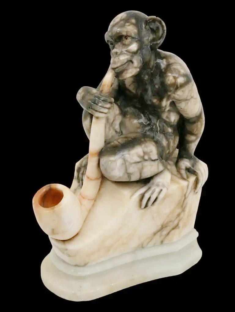 French marble sculpture, France, end 19th C. Monkey smoking a pipe. Marble and glass. Glass eyes. Measures: height : 9.8
