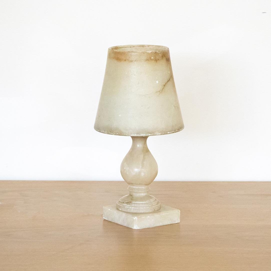 Beautiful heavy French marble table lamp with carved curvy base and tapered marble shade. Great creamy color stone with dark veins. Newly re-wired.