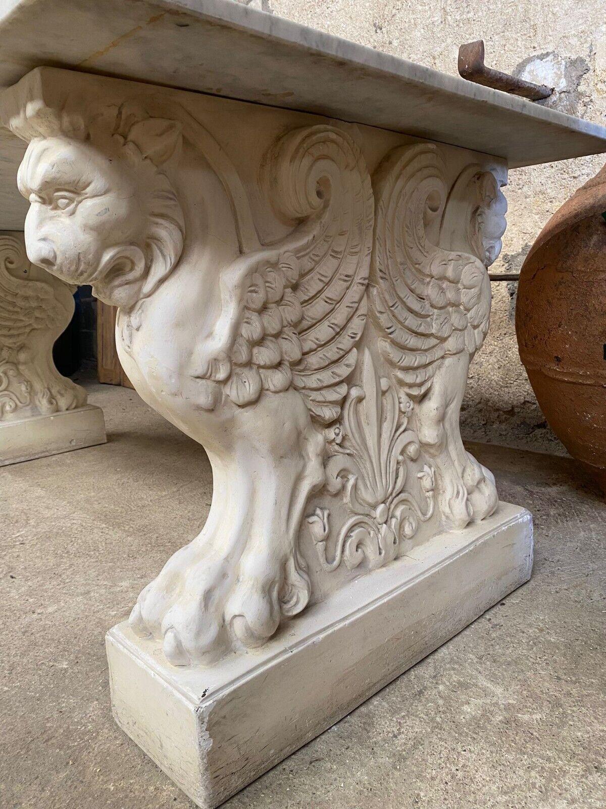 Add a touch of French elegance to your dining area with this stunning vintage marble dining table from Rocaille. Intricately designed with carvings of mythical creatures, this rectangular table boasts a timeless Renaissance style that will add